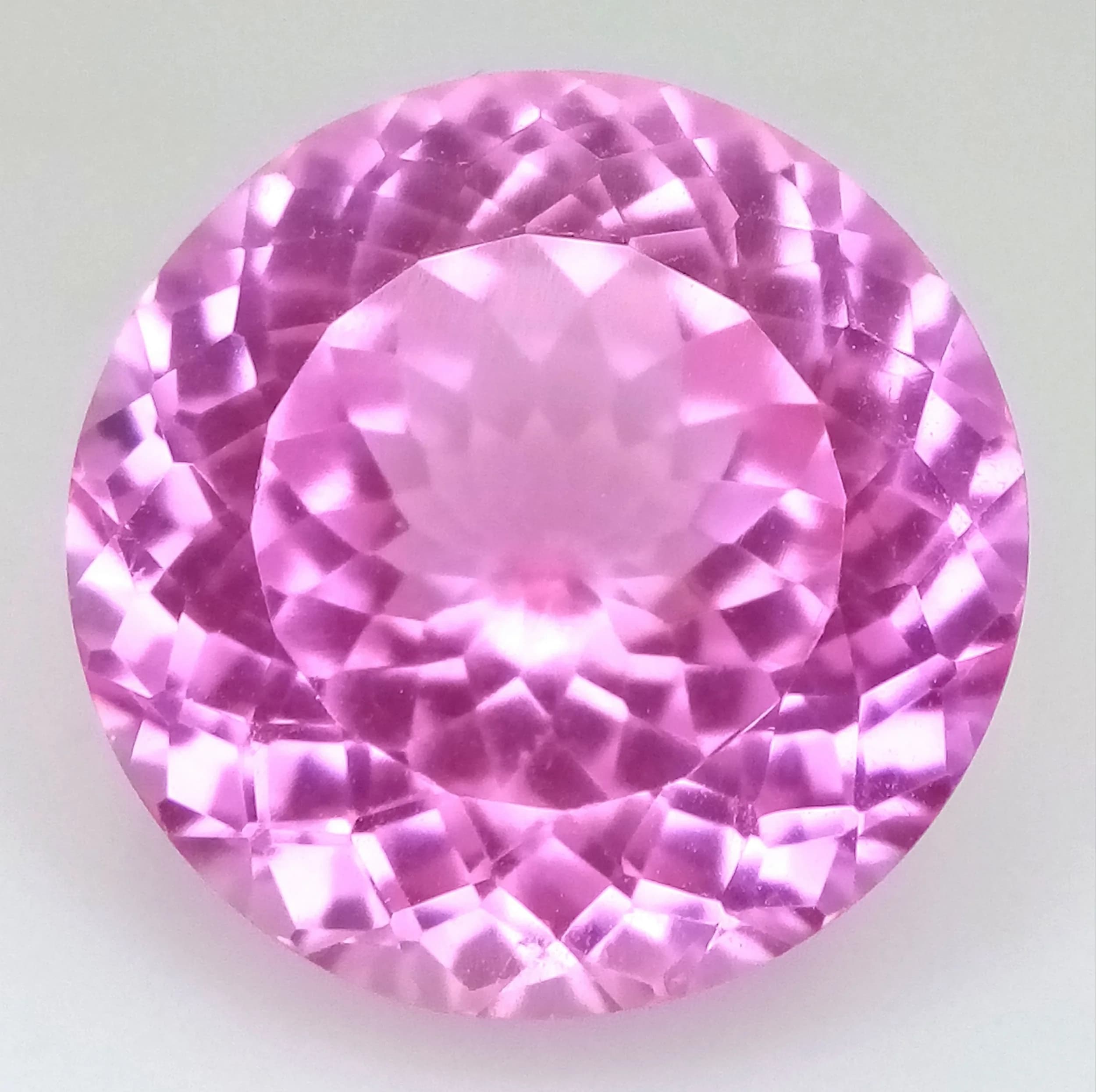 An 20ct Round Cut Pink Morganite Gemstone. Heat treated. No certificate so as found.