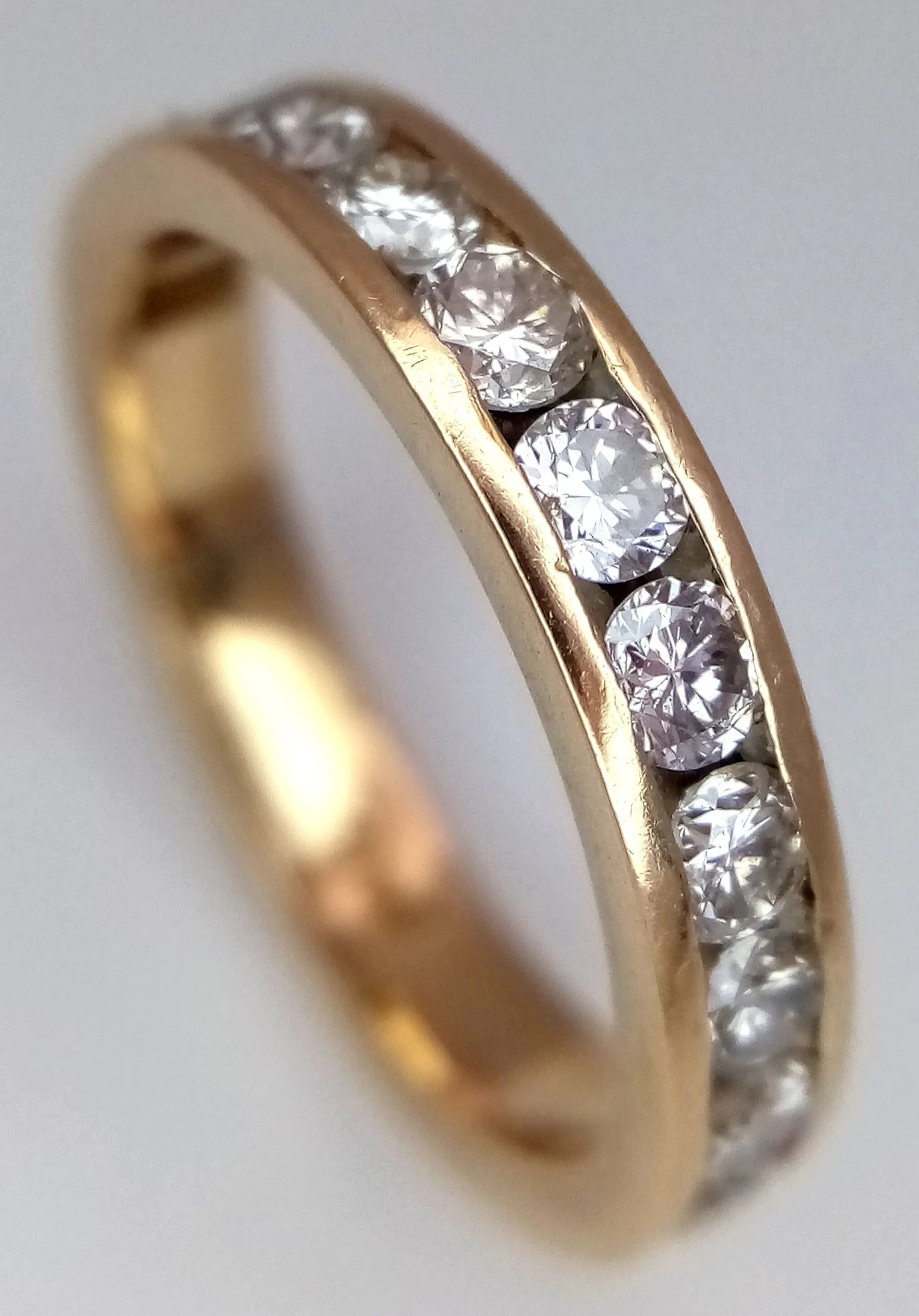 A 14K Yellow Gold, Diamond Set, half Eternity Ring. 0.55Ctw. 3.2G, Size J. Sc 4054