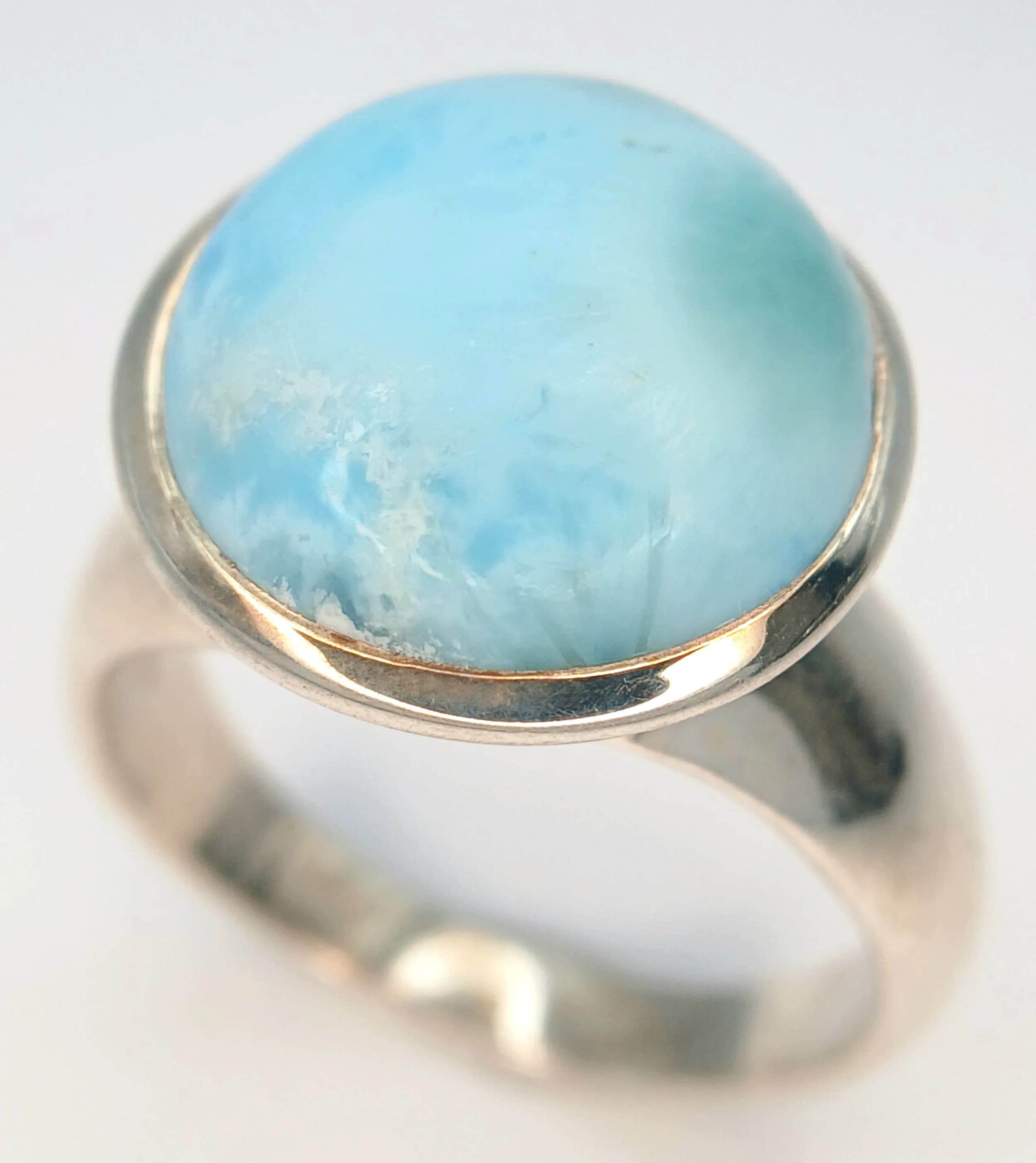 A Vintage, Unisex, Sterling Silver Larimar Cabochon Ring. Size U. The Ring is set with a 1.5cm Round Cut Larimar with the ring having a gross weight of 10.61 grams.