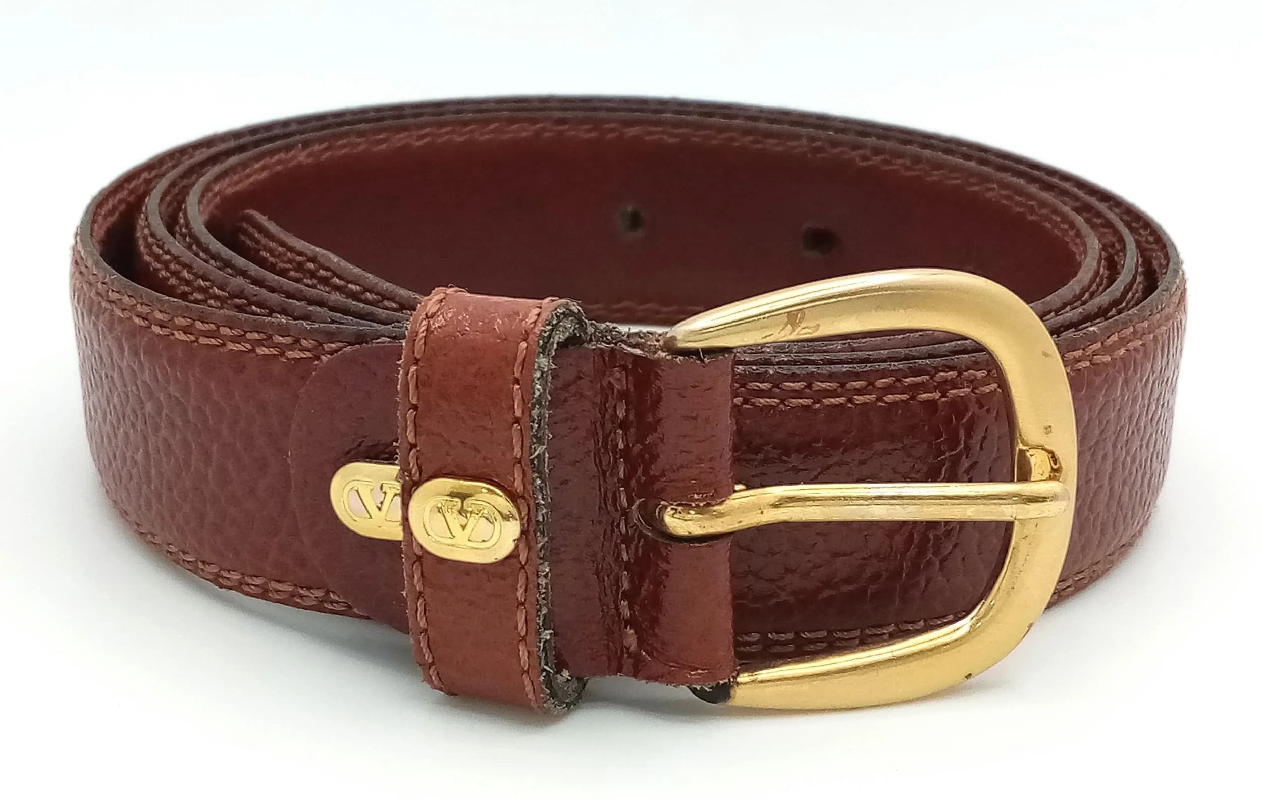 A Valentino Brown Leather Gents Belt. Gilded hardware. Original packaging. 110cm total length.