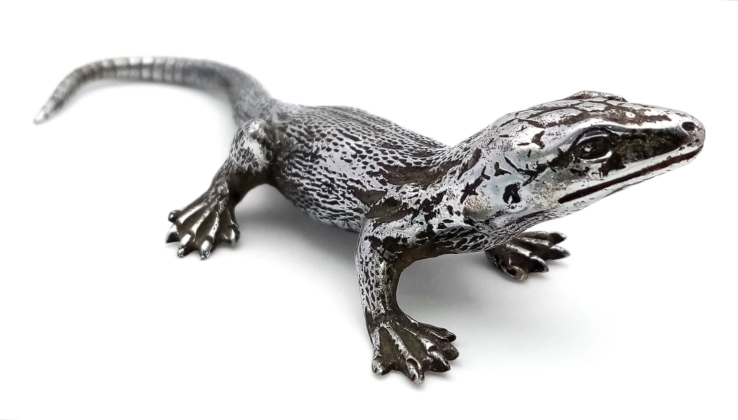 A Silvered Bronze Lizards by Franz Bergman (Austrian, 1861-1936). Approx 11cm length x 2.5cm height.