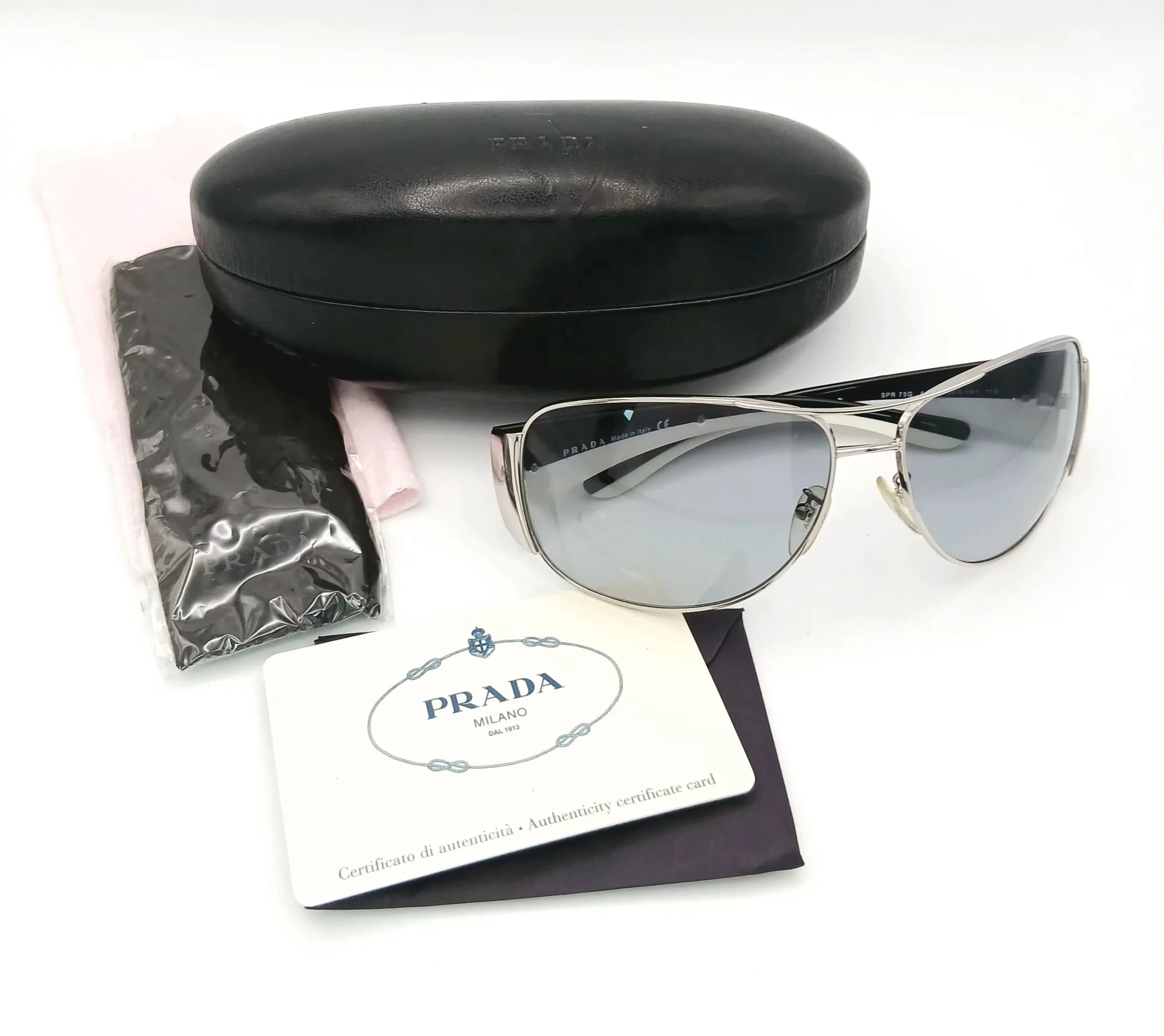 A Pair of Prada Two Tone Unisex Sunglasses. Comes with COA and case.