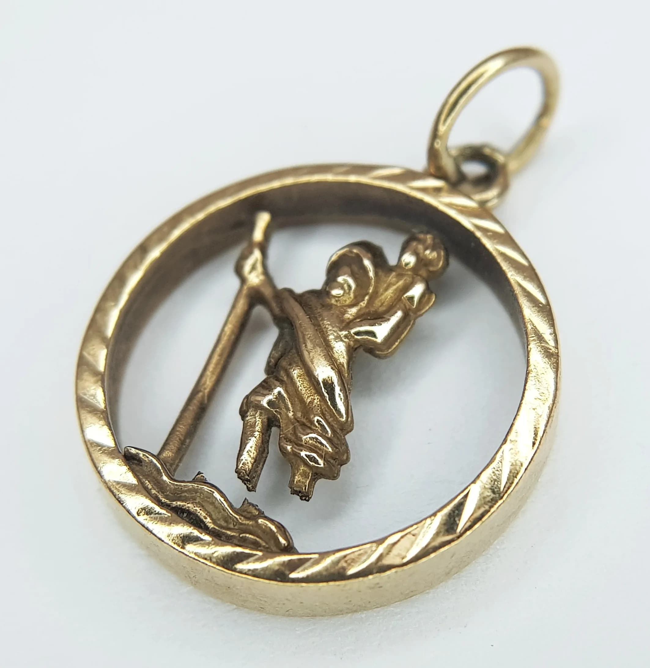 A 9K Yellow Gold Circular St. Christopher Pendant. 2cm. 2.35g. Legs detached - please see photos.
