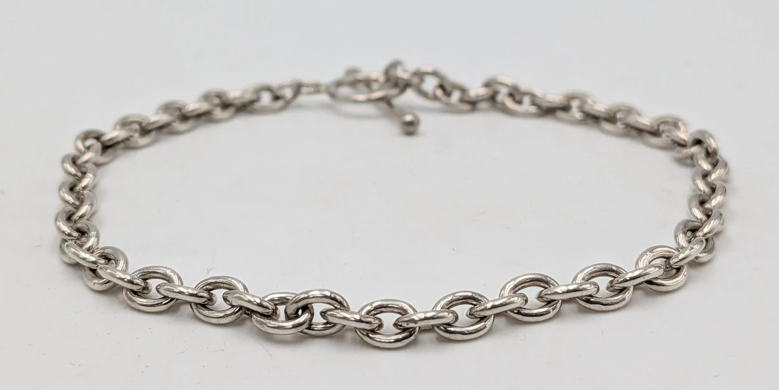 A Sterling Silver T-Bar Bracelet-19cm Length. 3mm width and weighs 6.93 grams.