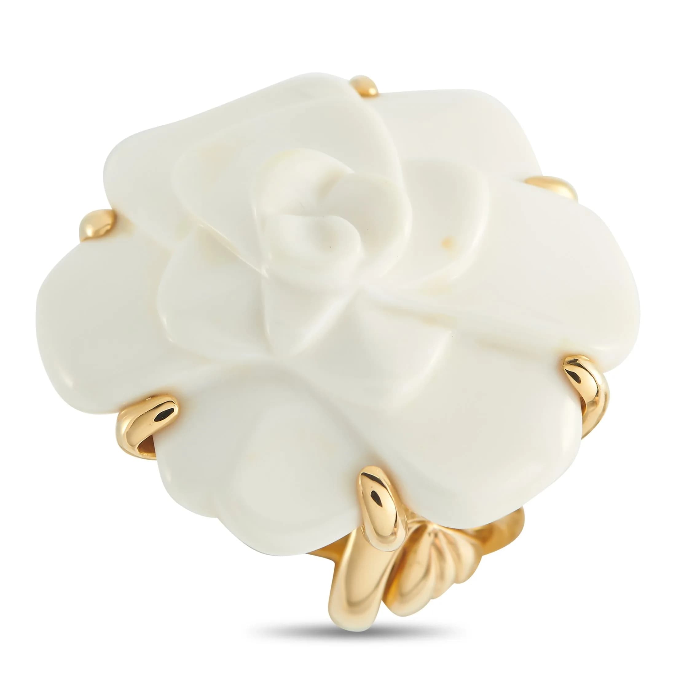 A Chanel Camelia 18K Yellow Gold White Ceramic Ring. The camellia design features layered white ceramic petals with rounded contours. The 18K Yellow Gold band forms a vine motif that wraps around the finger, with the stems forming six prongs that cup the lower tier of petals. Good condition and includes a gift box. Ring size: 4 (UK size H). Total weight: 20.2 grams. *This item is held at Cadmore USA Office in Pennsylvania, USA and will be shipped from there. Buyers will be responsible for direct shipping payments.*