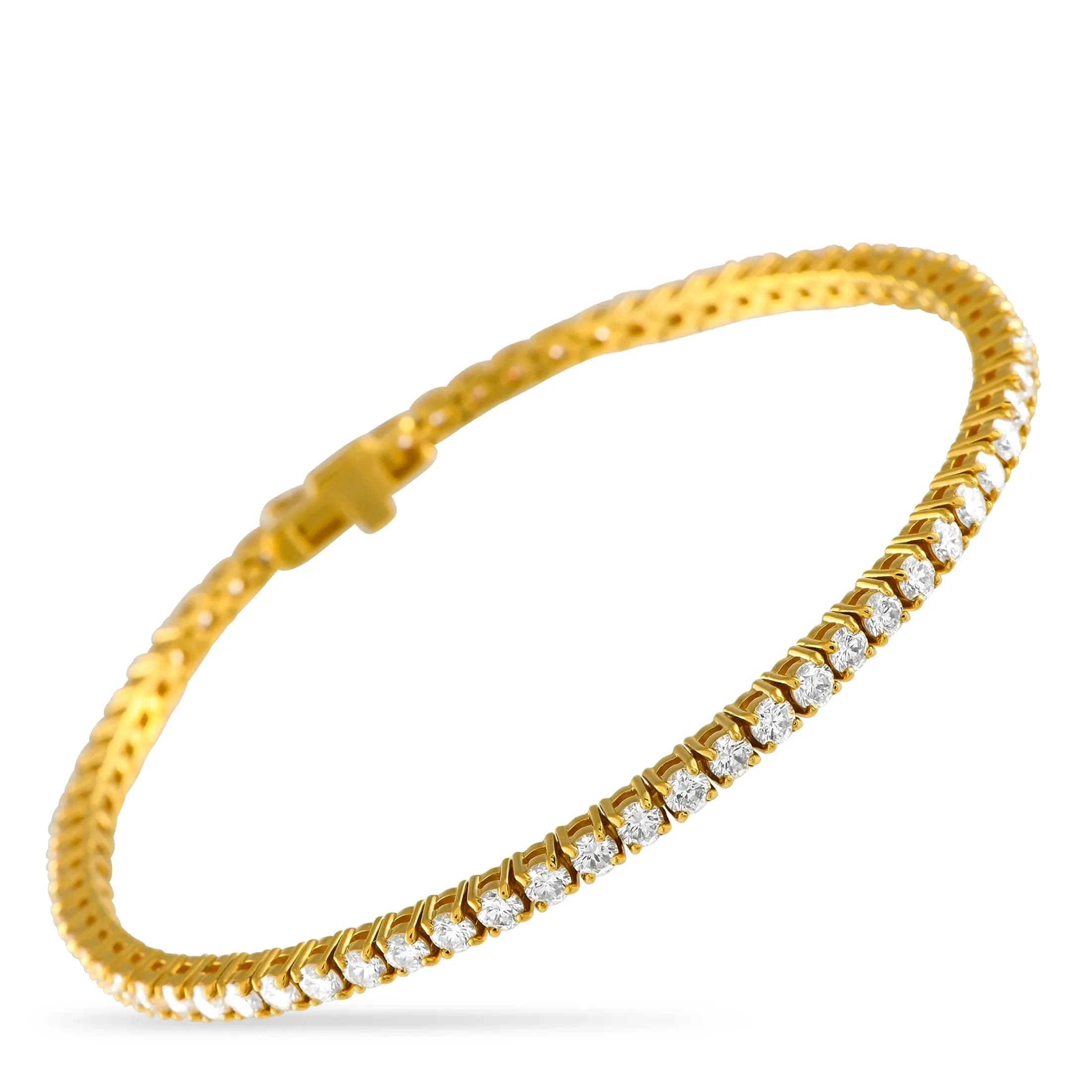 A 14K Yellow Gold 4.40ct Lab-Grown Diamond Tennis Bracelet. The 14K Yellow Gold setting features a series of lab-grown diamonds with a total weight of 4.40 carats. It measures 7.50 inches long and features a tab-insert clasp closure. Excellent condition and includes a gift box and diamond report. Total weight: 12.1 grams. *This item is held at Cadmore USA Office in Pennsylvania, USA and will be shipped from there. Buyers will be responsible for direct shipping payments.*