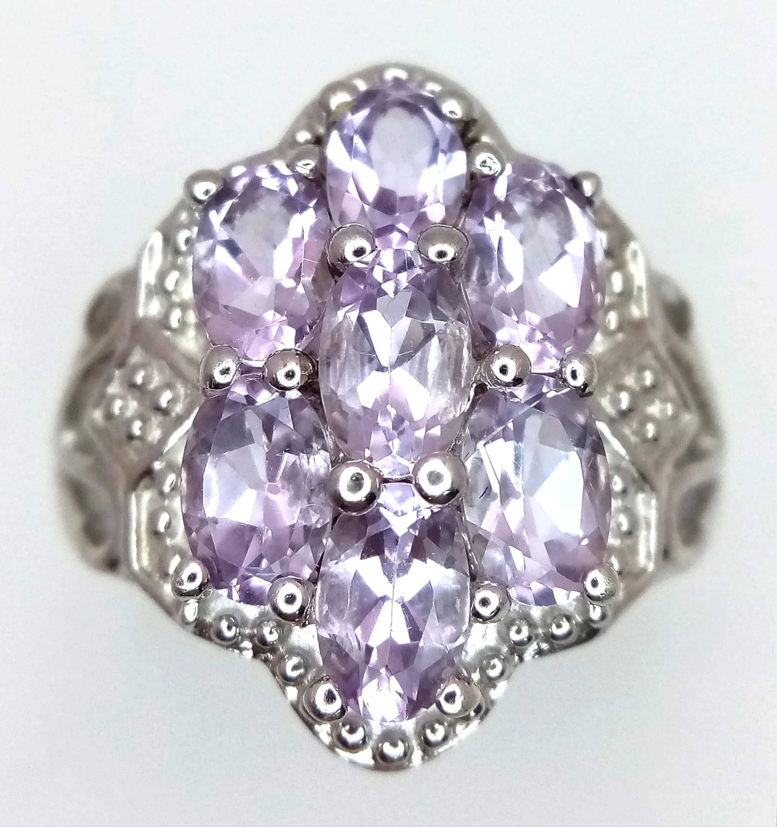 A Pretty Sterling Silver Pale Amethyst Set Cluster Ring. Size O. The Ring measures 2cm Length at the Crown and has a gross weight of 6.23 grams.