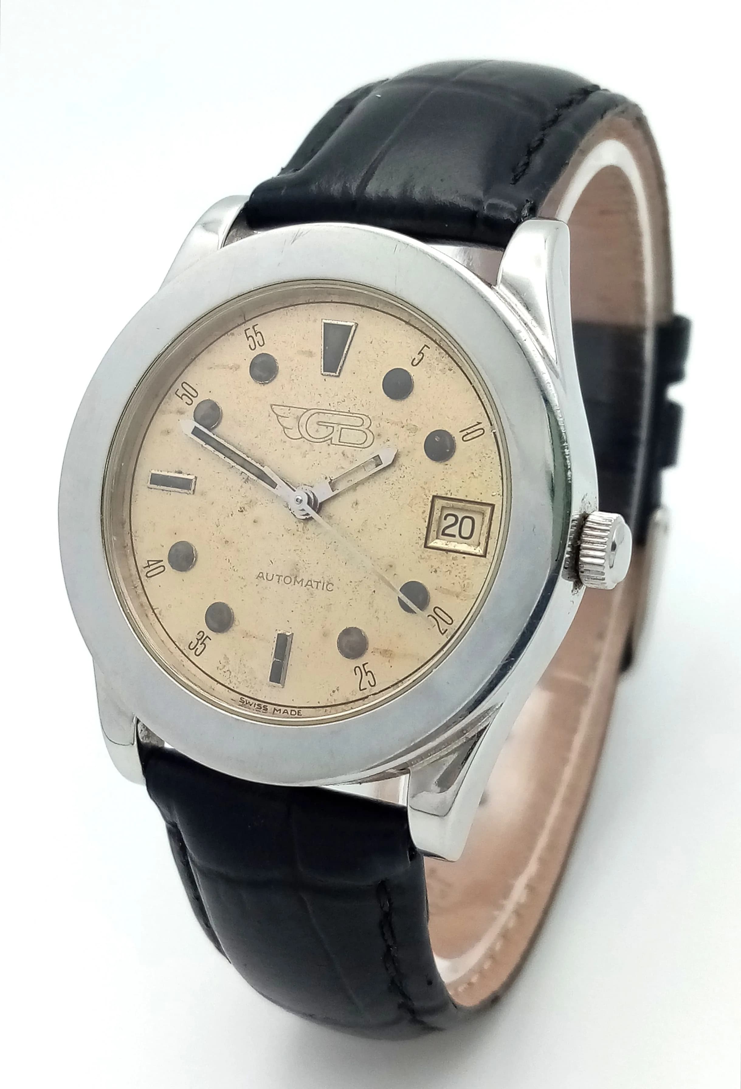 A Vintage Gianni Bulgari Timeo Automatic Gents Watch. Black leather strap. Stainless steel case - 36mm. Patinaed cream dial with date window. 0.278 marking on side case. In working order.