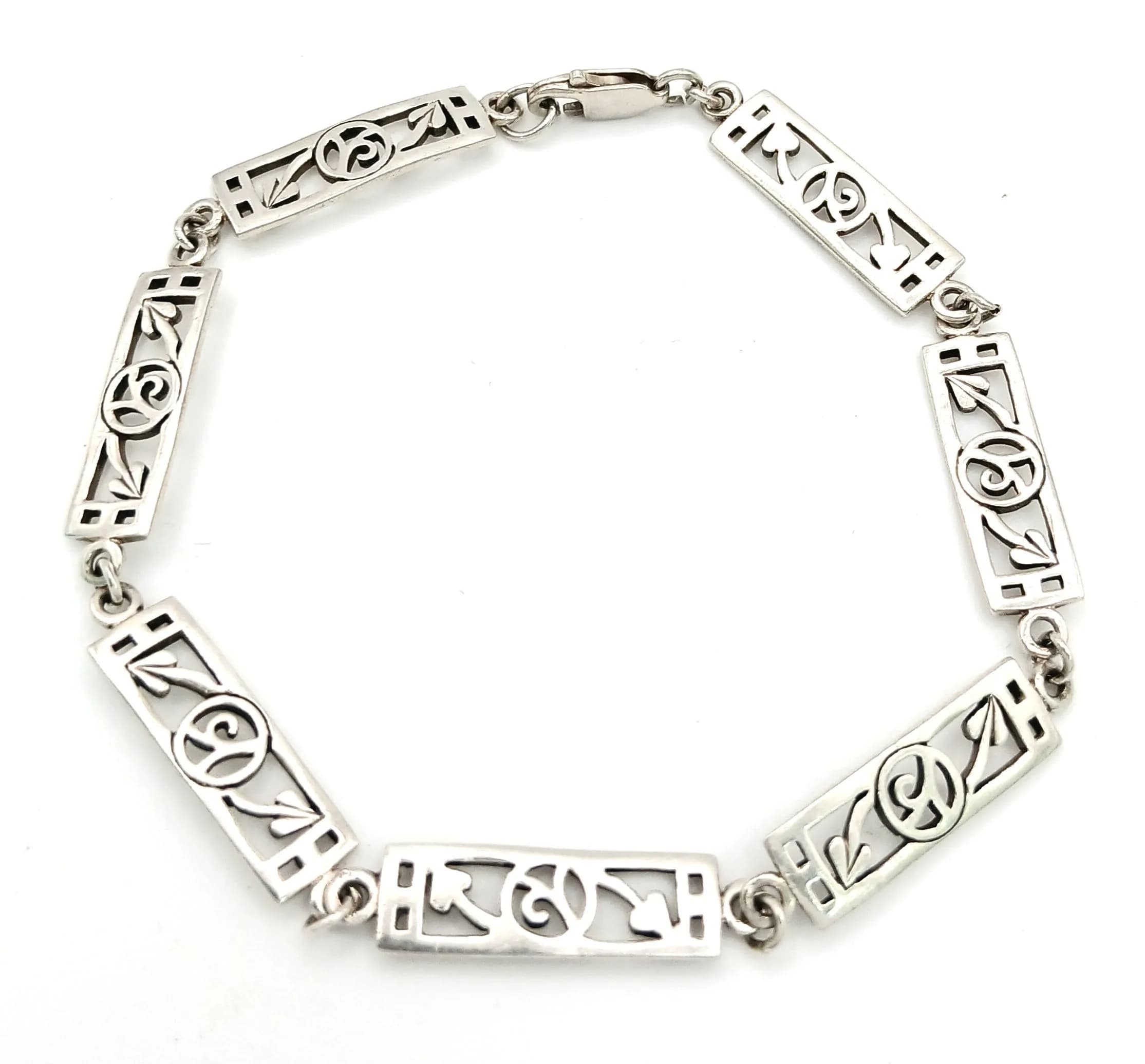 A Vintage Sterling Silver, Charles Rennie Mackintosh Design, Bracelet-19cm Length. 6mm Width and weighs 7.26 grams.