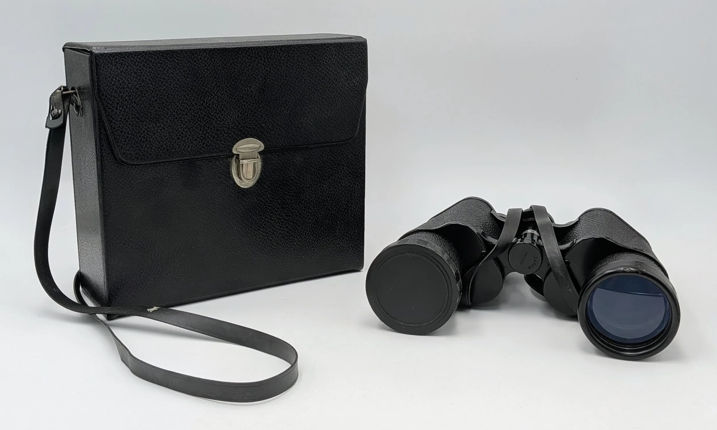 A Pair of Mark Scheffel 10x50 Binoculars. Triple tested, 288ft at 1000yds, presented in a fitted black carrying case.