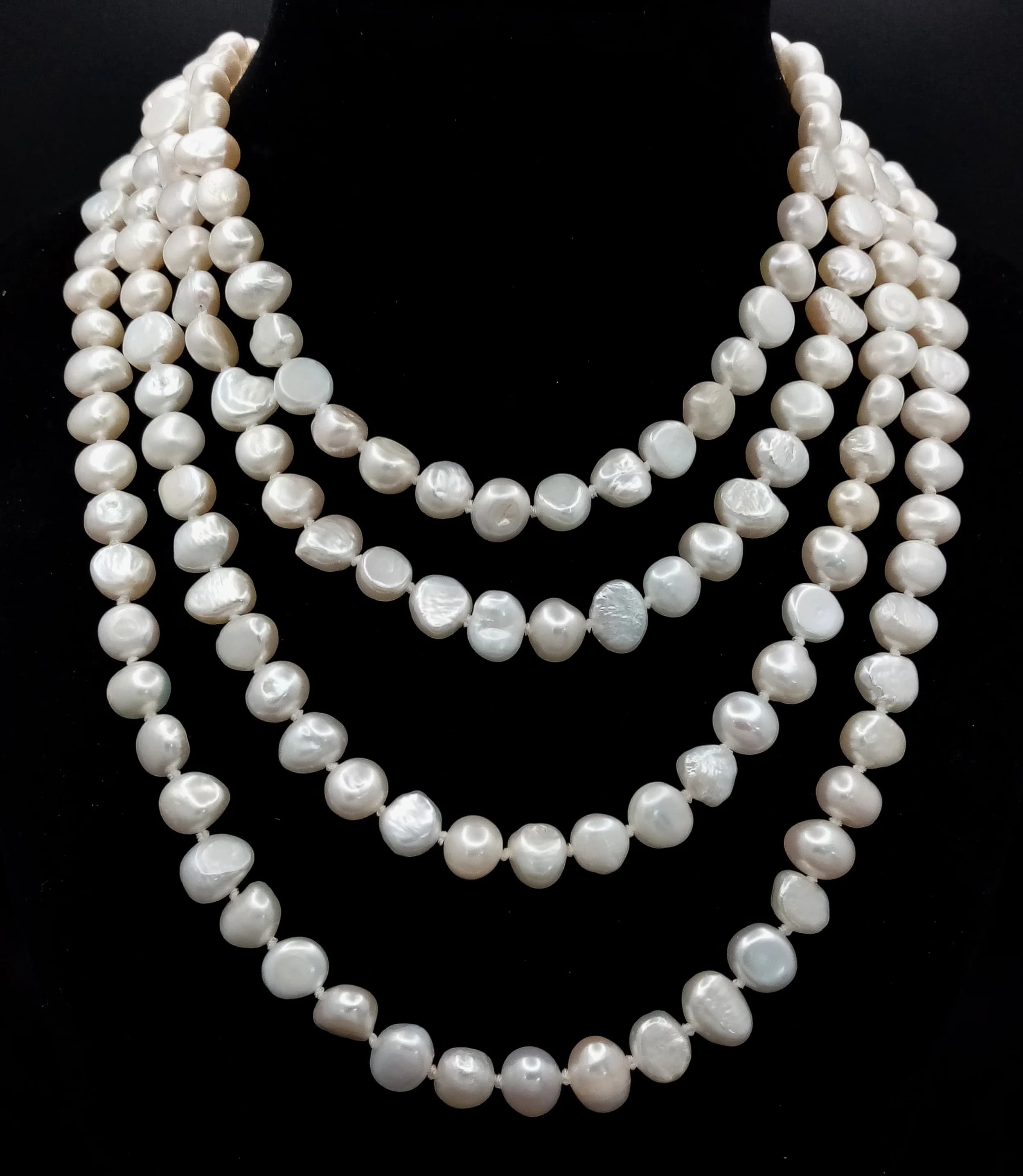 A magnificent rope Length large baroque Freshwater Pearl Necklace, approx 164cm in length, strung with cream freshwater pearls in varying shapes and sizes. Please see photos for details.