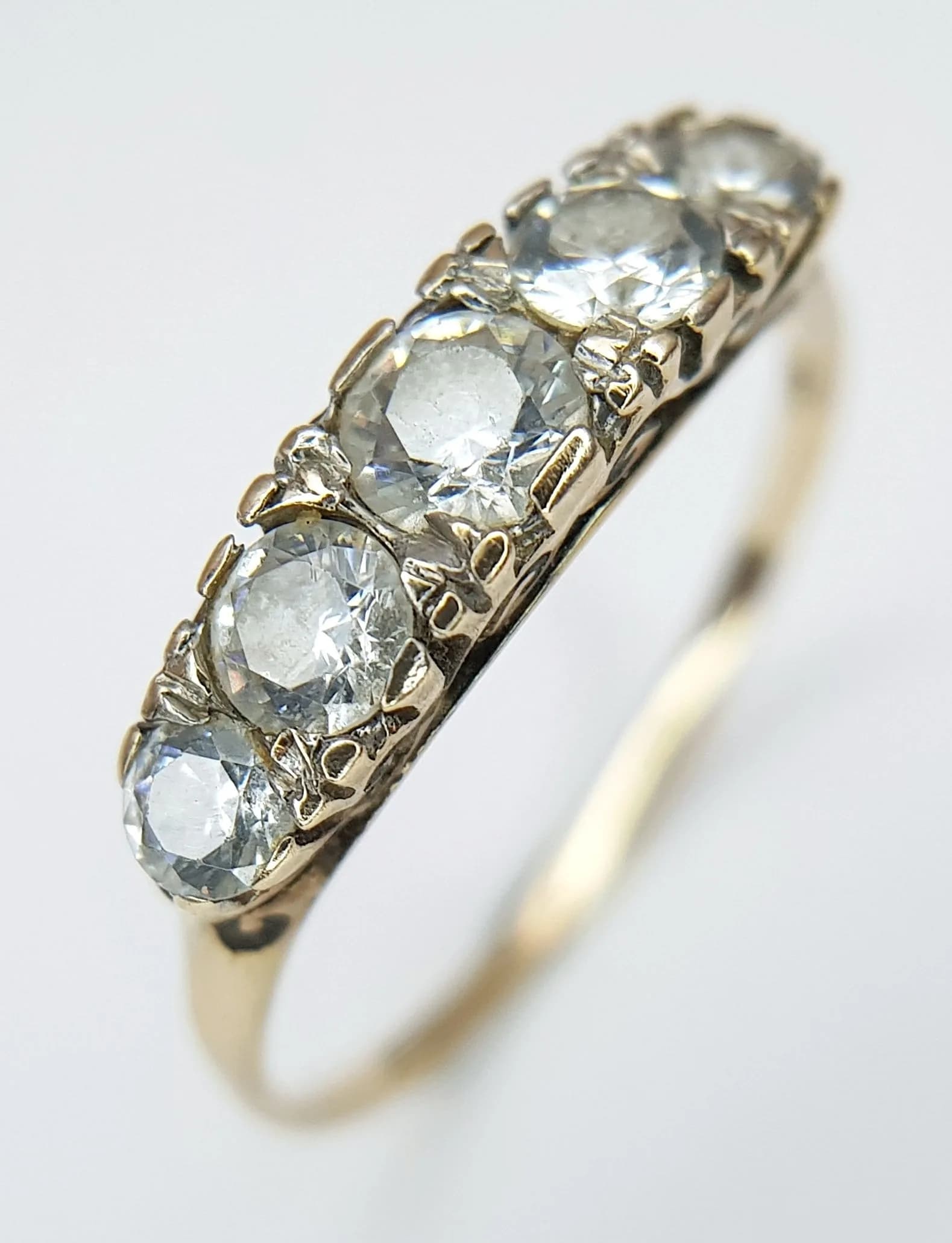 A 9K Yellow Gold CZ Five Stone Dress Ring. Size N. 1.6g total weight.