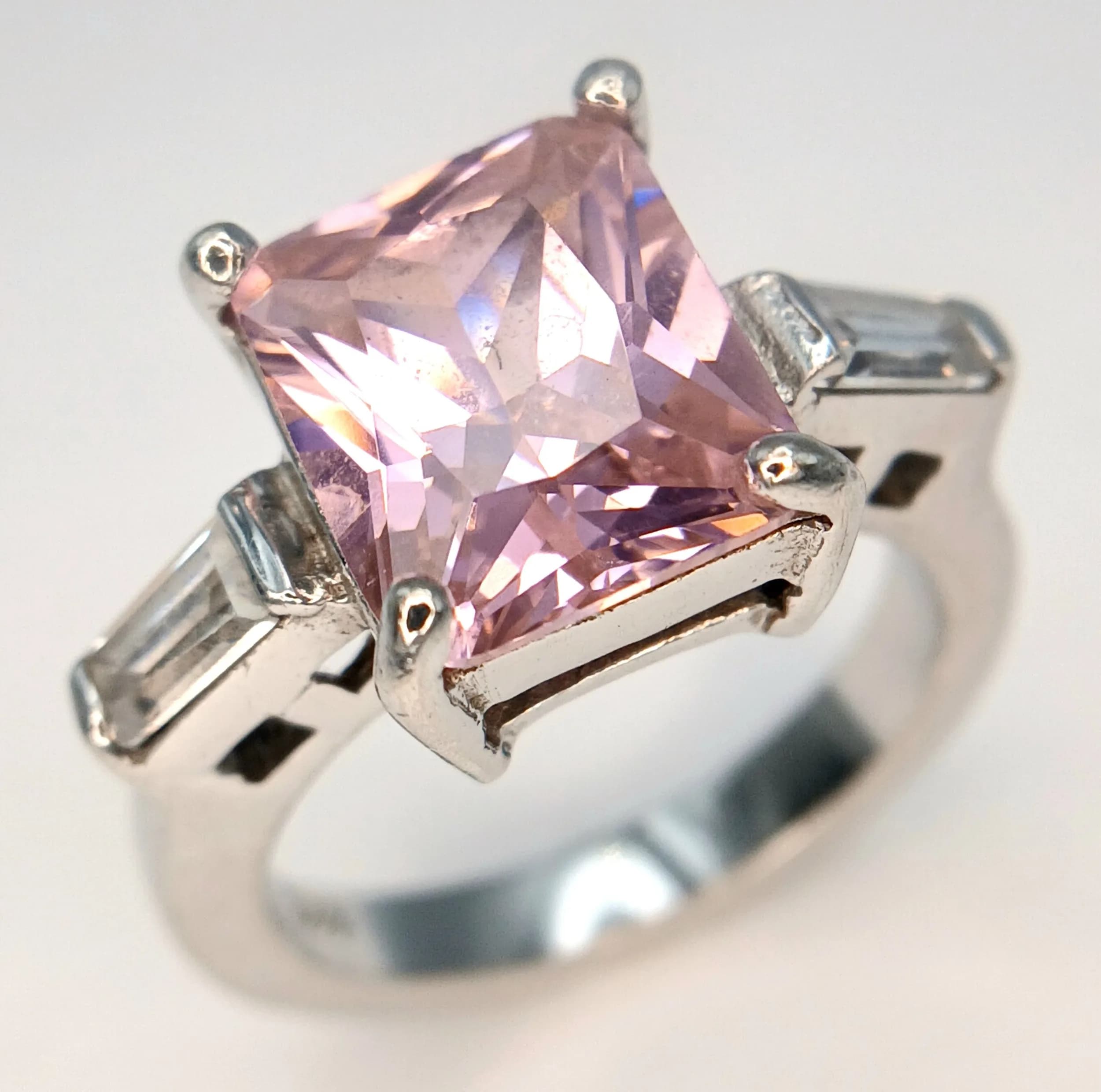 A Sterling Silver Pink and Clear Stone Ring Size N. The Ring measures 1.1cm Long at the Crown and has a gross weight of 7.21 grams