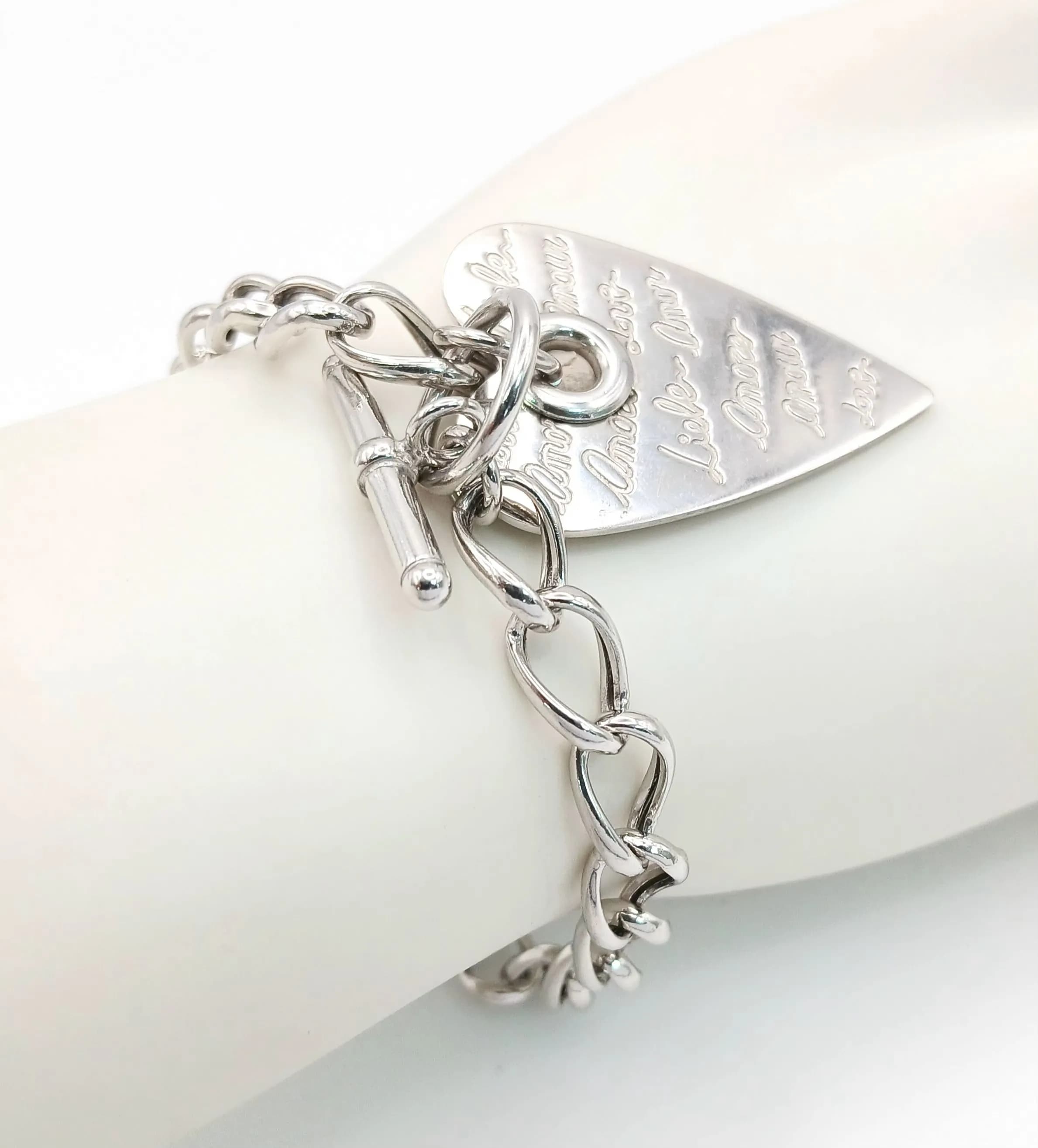 A Sterling Silver, Elongated Heart, Charm Bracelet. 12.8G. J Sil 4011