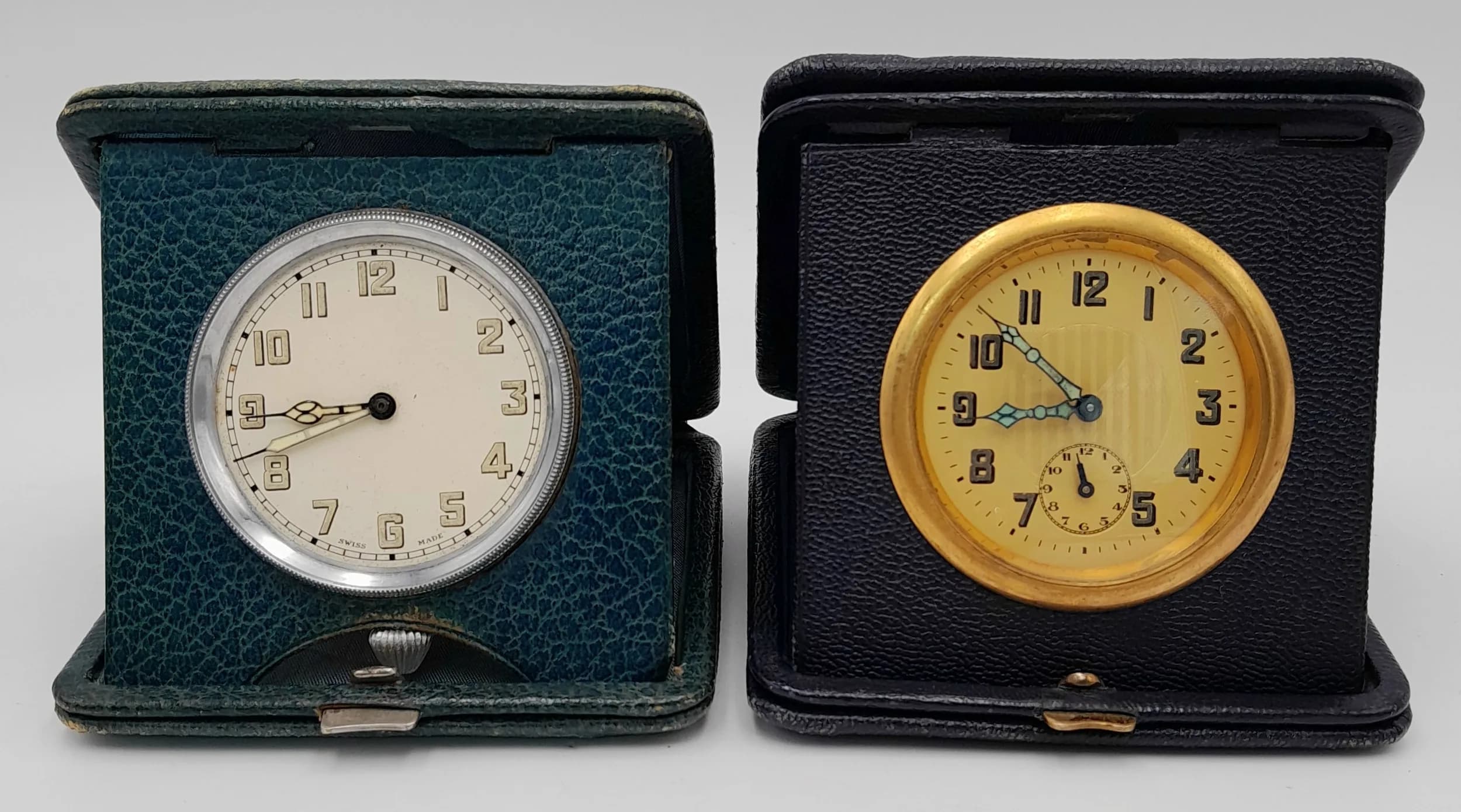 Two Vintage Travel Clocks in Cases. Both in working order.