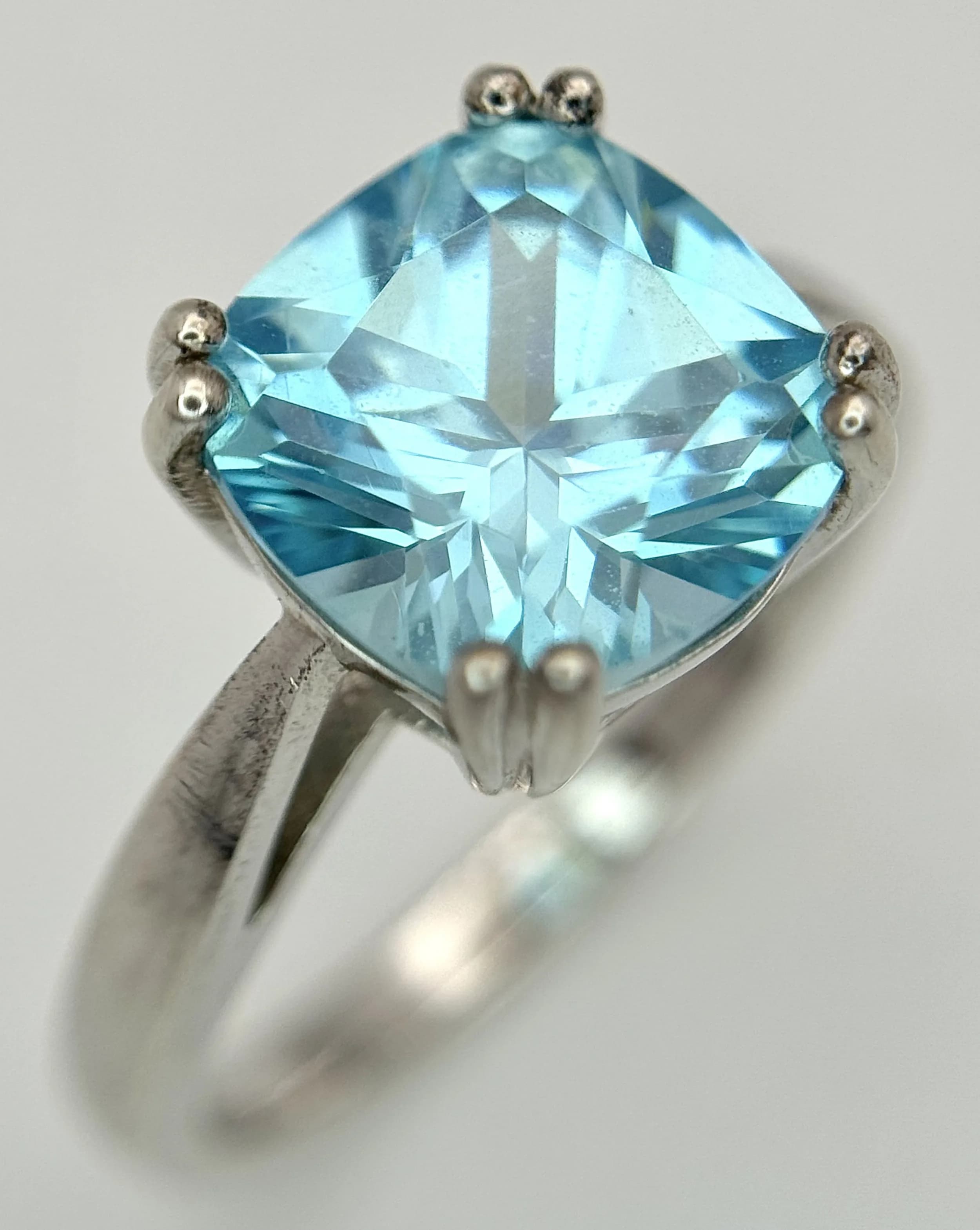 A Sterling Silver Blue Stone Solitaire Ring Size P. The Ring measures 1cm Wide at the Crown and has a gross weight of 4.46 grams