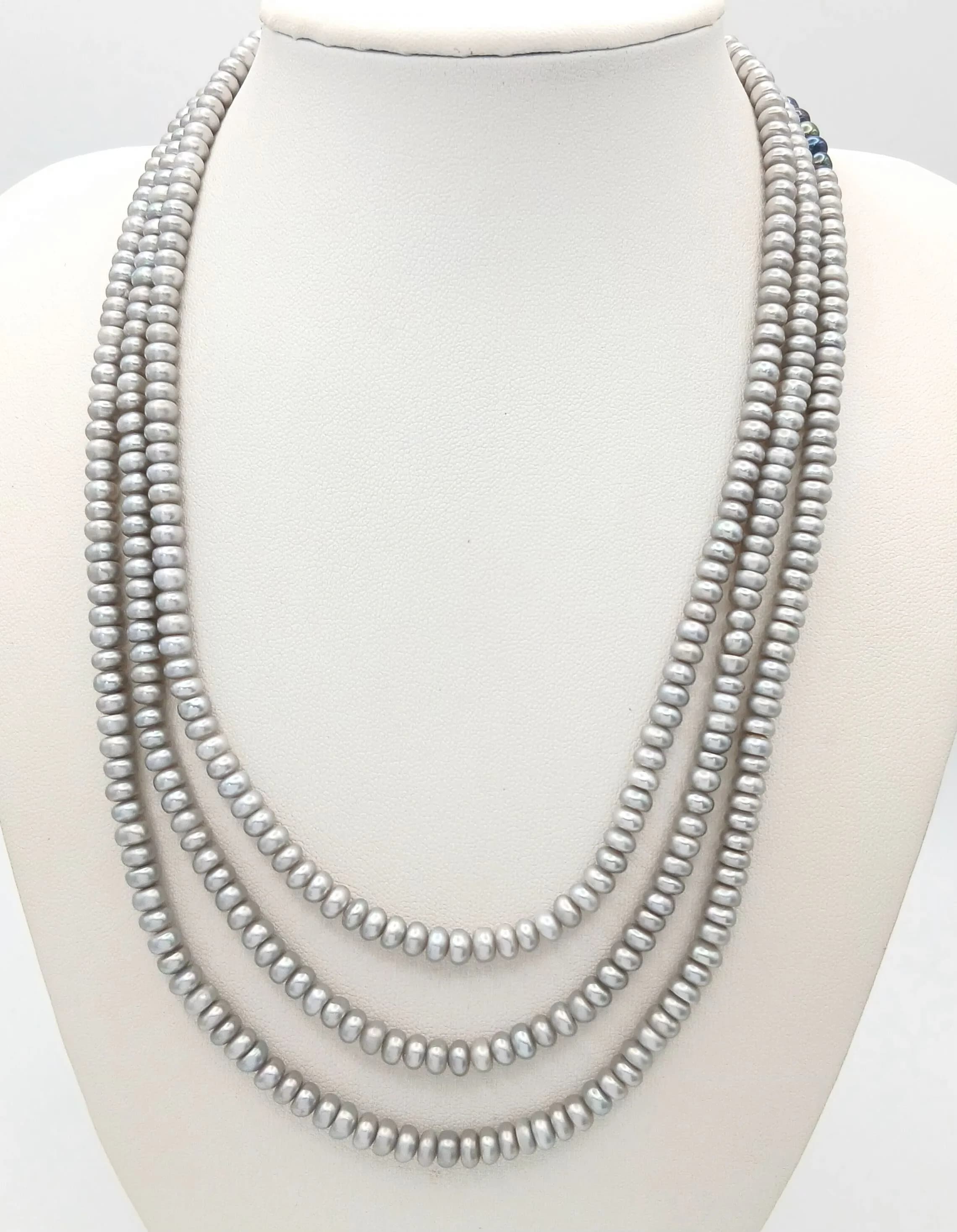 A pretty Three Strand Light Grey Freshwater Pearl Necklace. Approx 43cm in length, strung with light grey freshwater pearls and gilded floral box clasp. Please see photos for details.