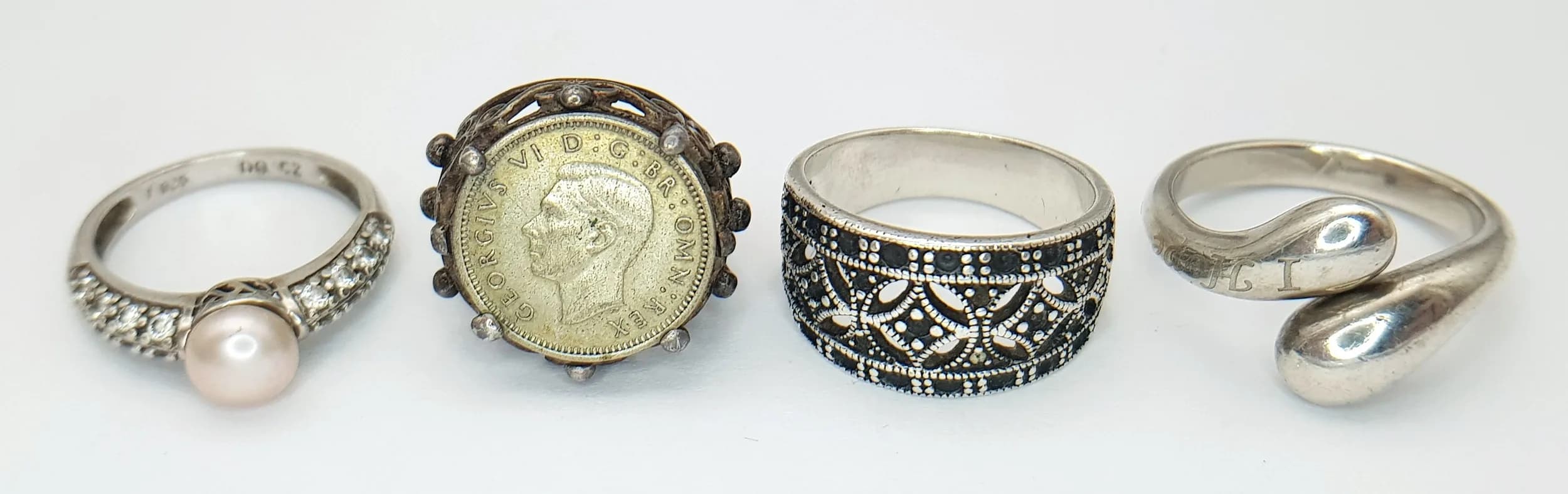 Four Different Style Silver Rings. 2 x N, 1 x J, 1 x P. 20.3g total weight.