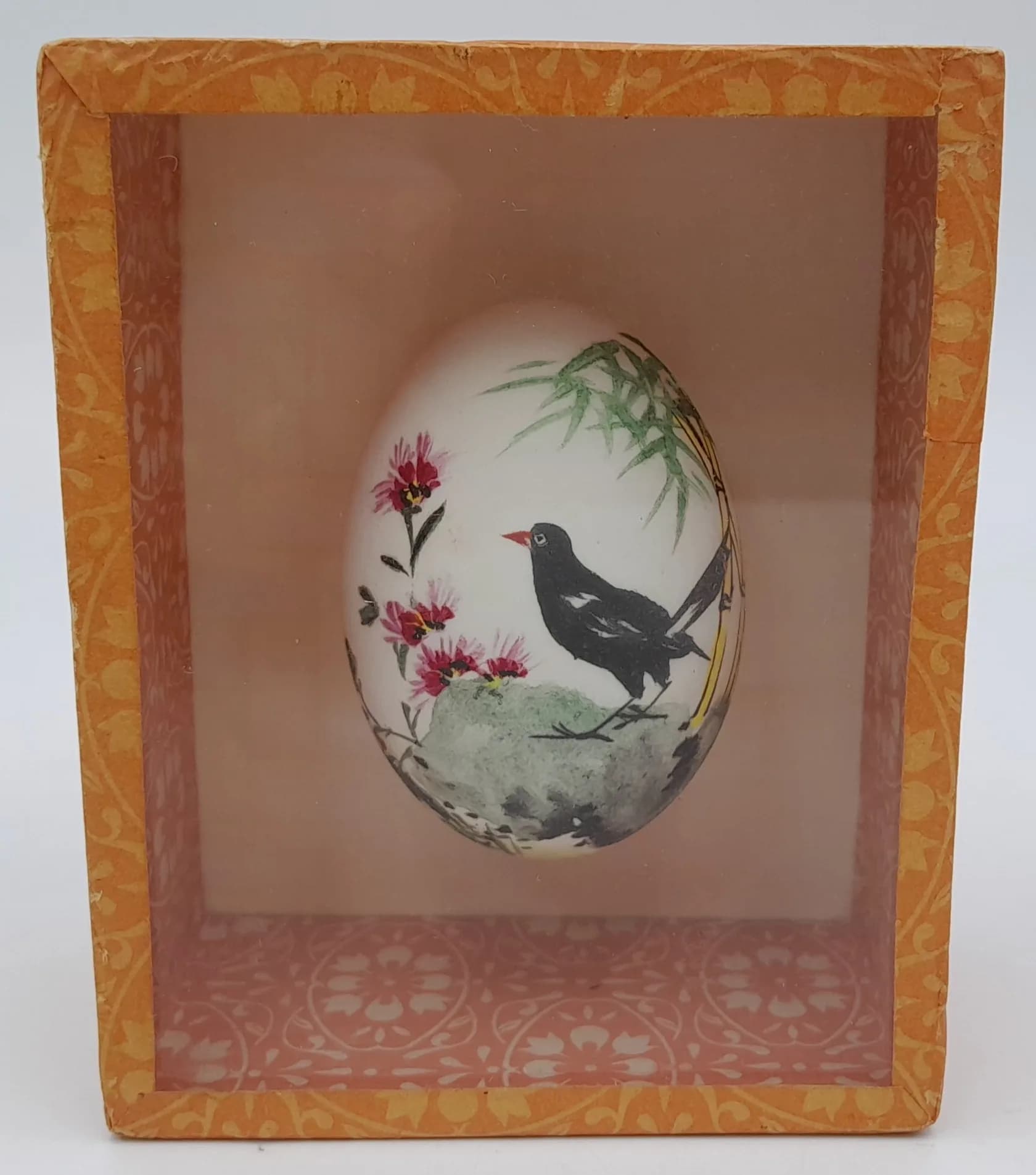 A vintage, Chinese hand painted egg in a wooden display box. Nice condition.