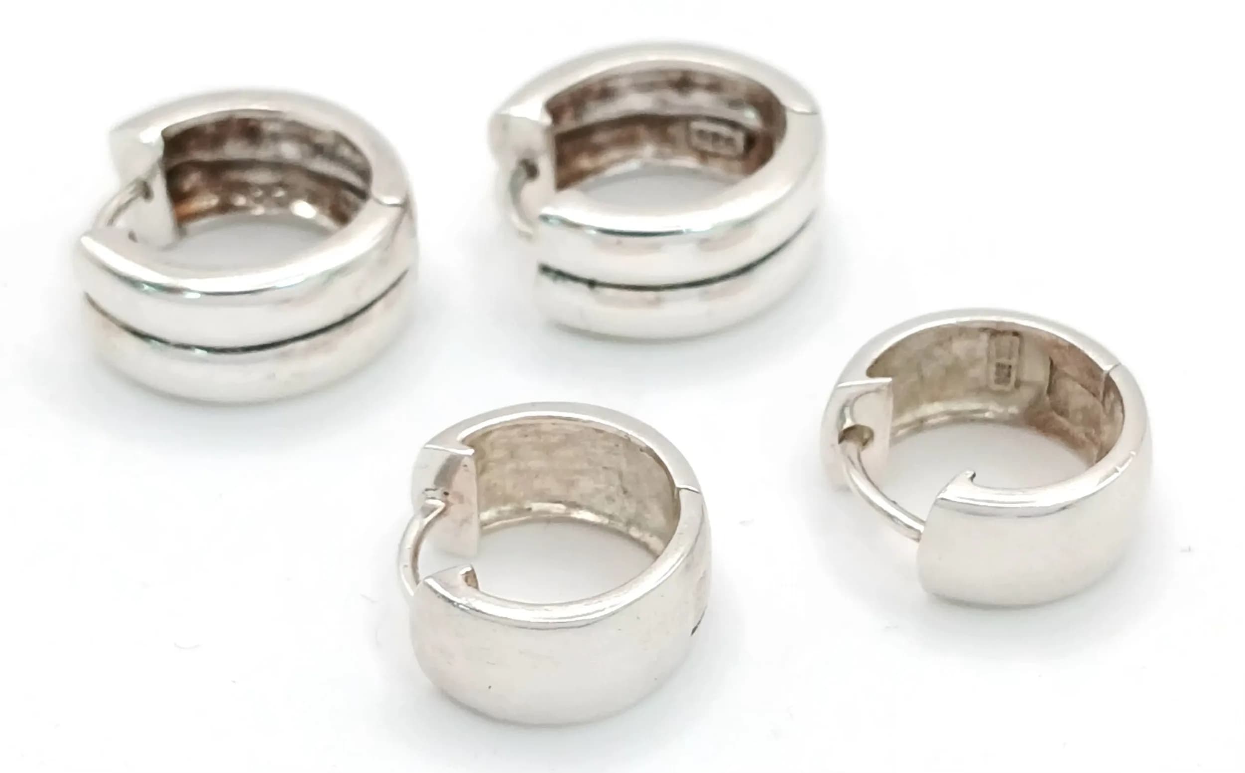 2X pairs of 925 silver hoop earrings. Total weight 12.1G. Please see photos for details.