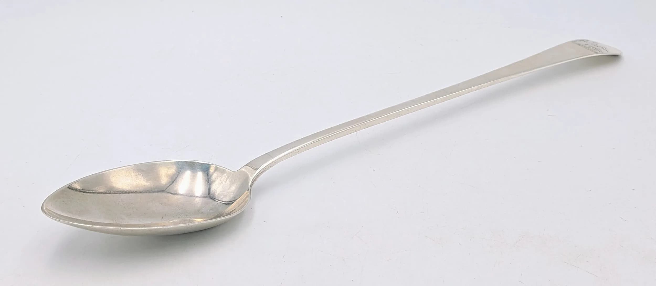 A Georgian Large Sterling Silver Serving Spoon. Engraved Eagle crest. 31cm. 101g.
