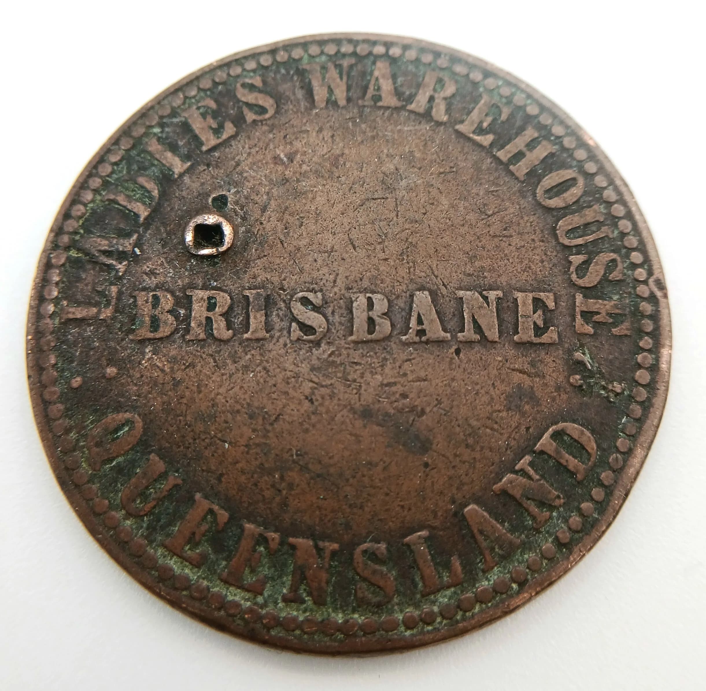 An Antique (circa 1860s) Australian J.W. Buxton Copper Store Token. Two drill holes.