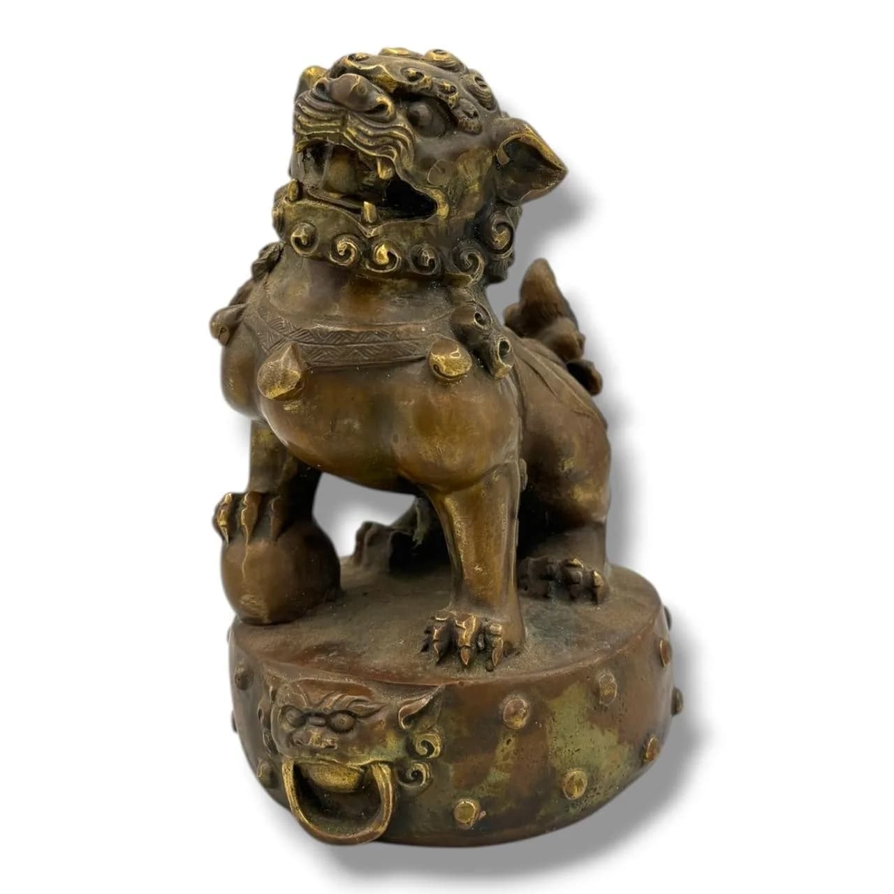 An antique Asian Bronze Foo Dog Figure on Stand. Bronze exterior with raised decorative details, guardian lion form, rounded base and mask ring handle detail. Some signs of age-related wear, tarnishing, surface marks and discolouration throughout. Approx 15.5cm height x 11cm width. Please see photos or request a condition report.This item is held at Cadmore ASIAN Office in Vietnam and will be shipped from there. Buyers will be responsible for direct shipping payments. Delivery will take slightly longer.