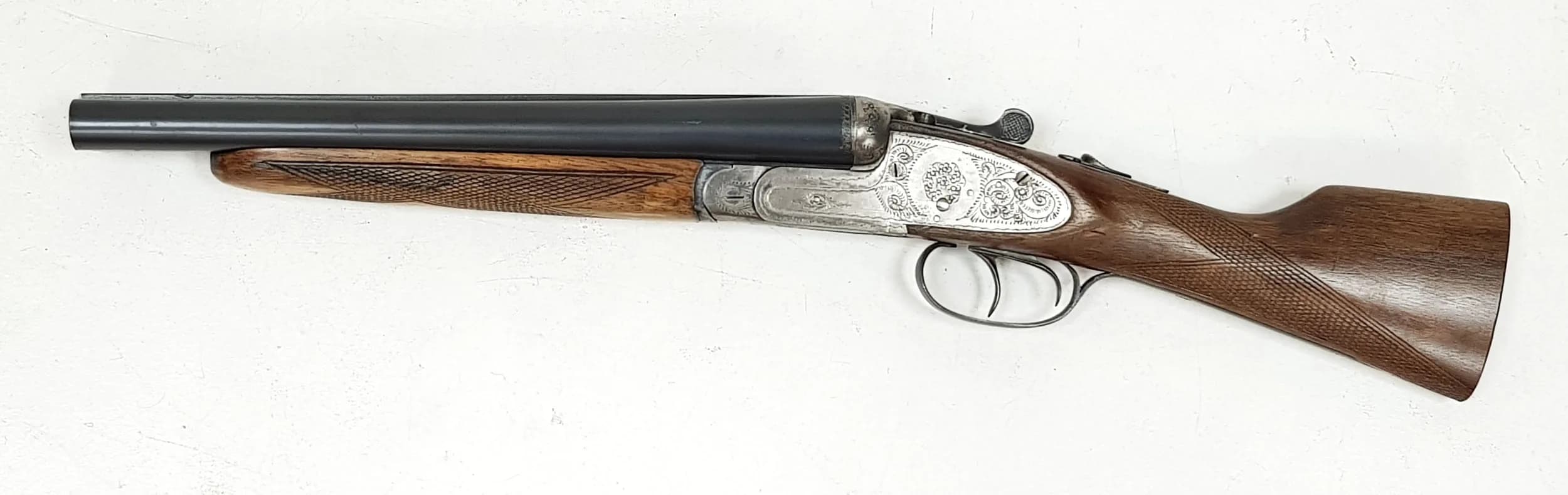 A Deactivated Spanish Parkemy Side By Side 12 Gauge Sawn-Off Shotgun. 12 inch barrel length. EU deactivation certificate. EU/UK sales only - Not Holland. 94cm total length. UK Mainland shipping only or arrange a courier.
