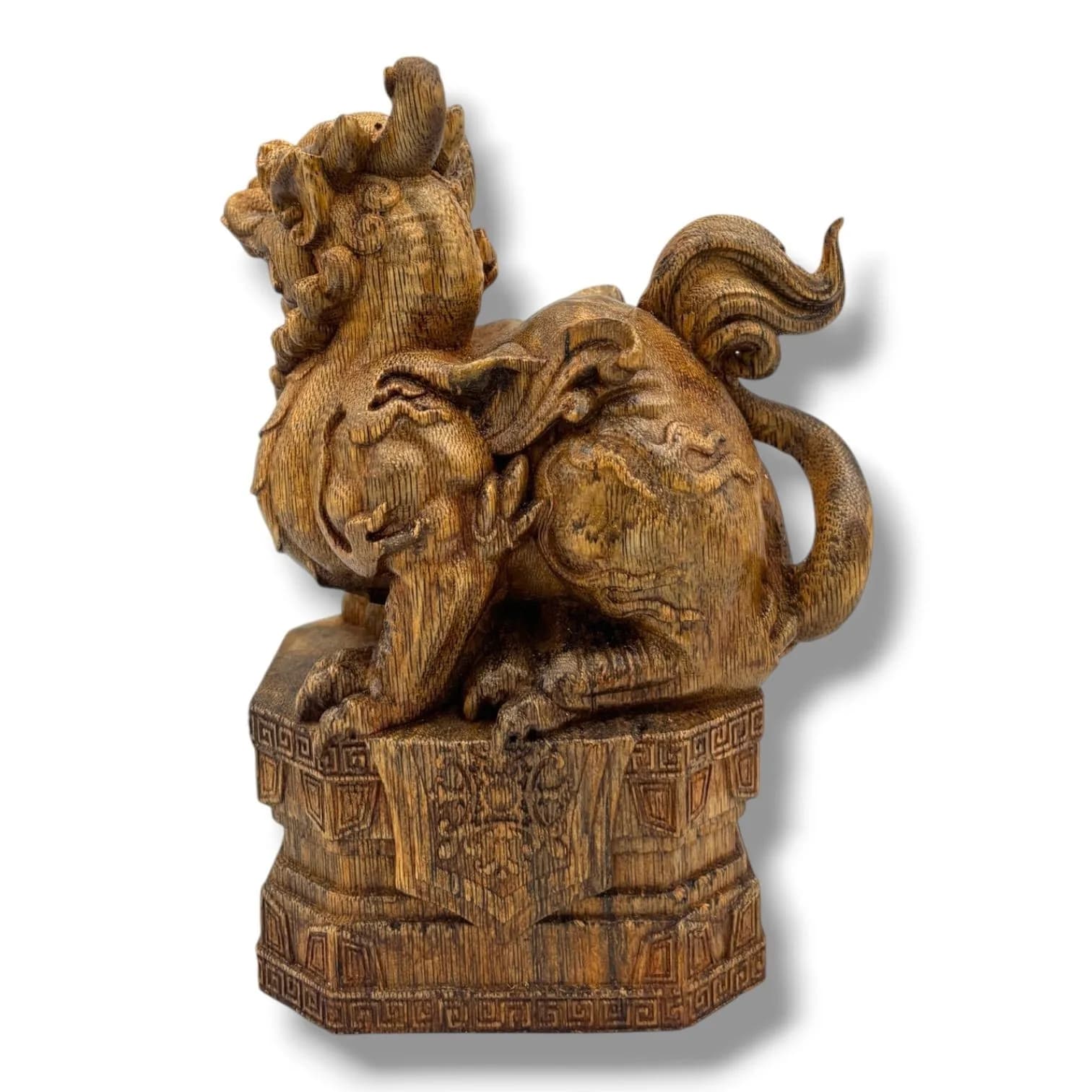 A hand Carved natural Agarwood Dragon Figure.The natural agarwood fragrance is well known for its purposes in relaxation and meditation.Brown agarwood carving depicting a seated dragon with elaborate scrolling mane and tail, raised on a geometric decorated pedestal base. Some surface wear, scratches, rubbing and natural imperfections to the wood. Approx 15cm height x 11cm width. Please see photos or request a condition report.This item is held at Cadmore ASIAN Office in Vietnam and will be shipped from there. Buyers will be responsible for direct shipping payments. Delivery will take slightly longer.