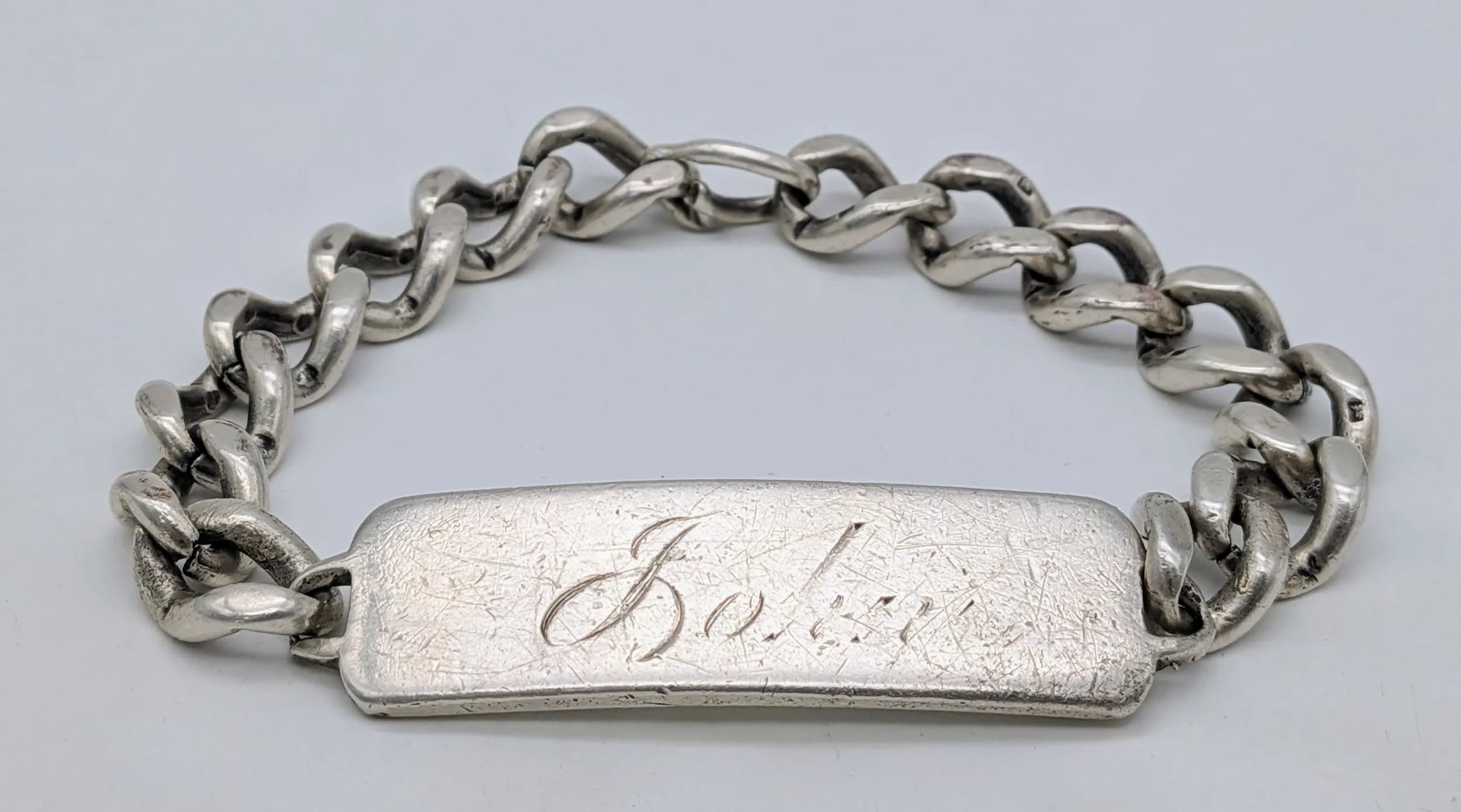A Sterling Silver Curb Link Identity Bracelet. Slip on. 17/18cm. 46g.