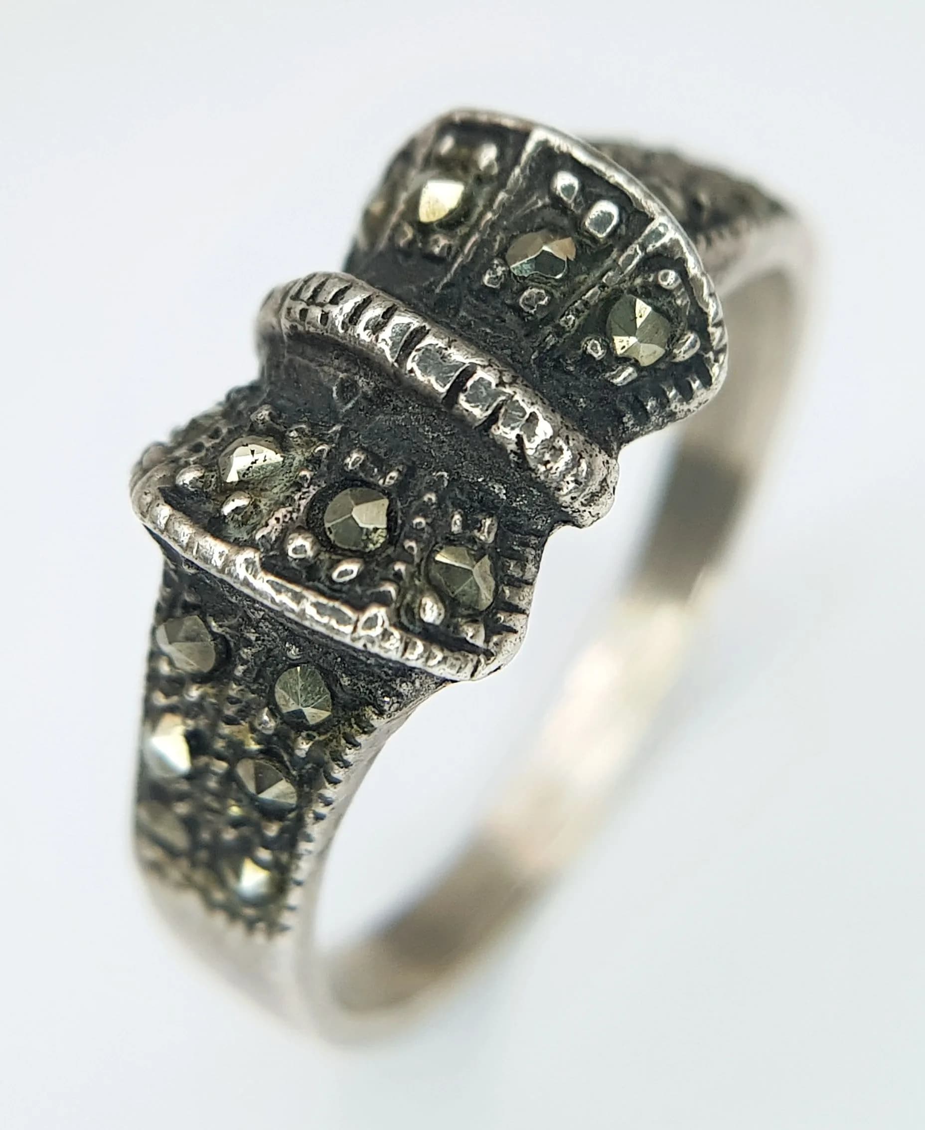 A Pretty Silver Marcasite Bow Ring. Size R. Features a bow design set with marcasite stones and decorative shoulders. Gross weight 3.3 grams.