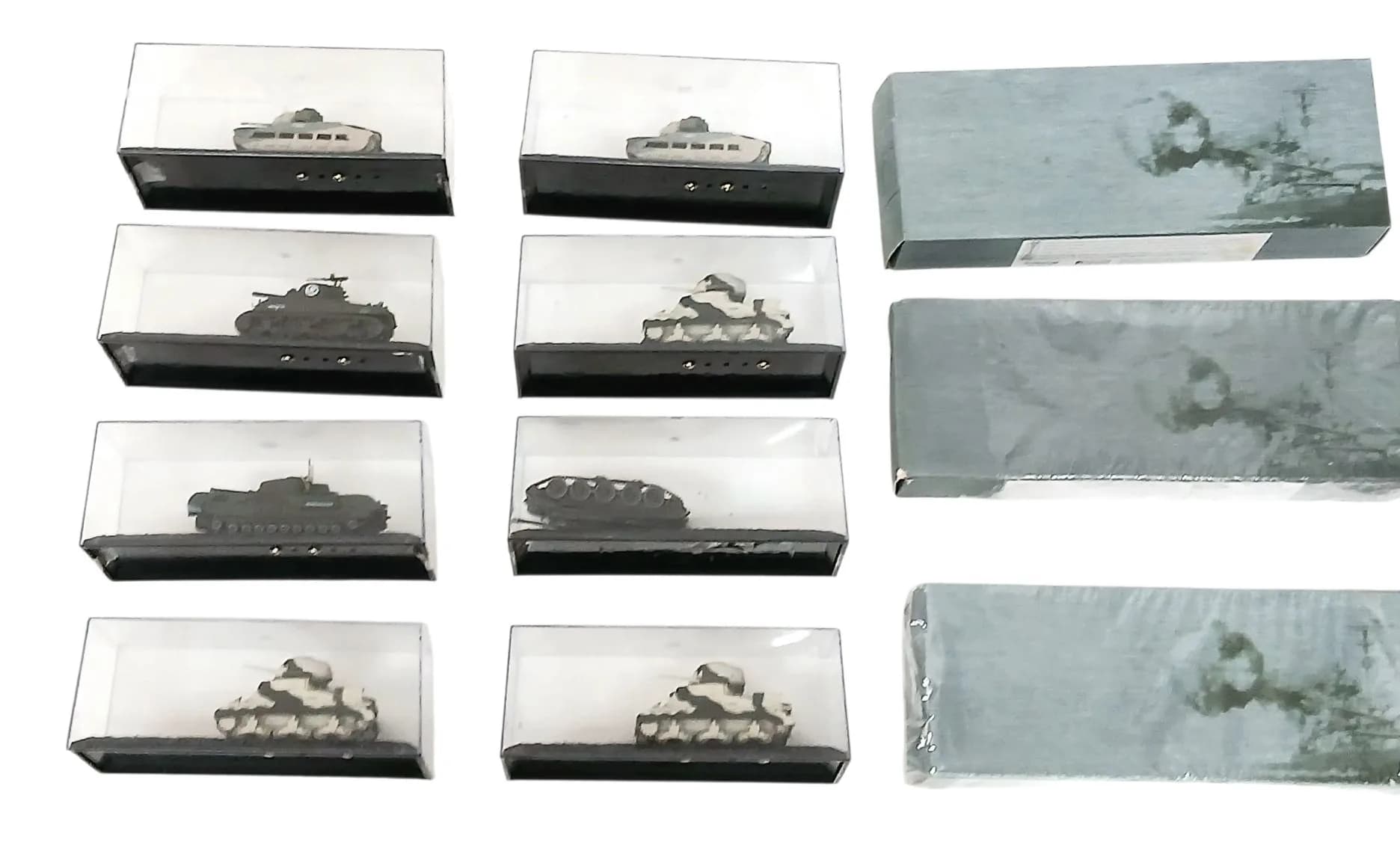 A collection of military die cast models. Including tanks and boats.