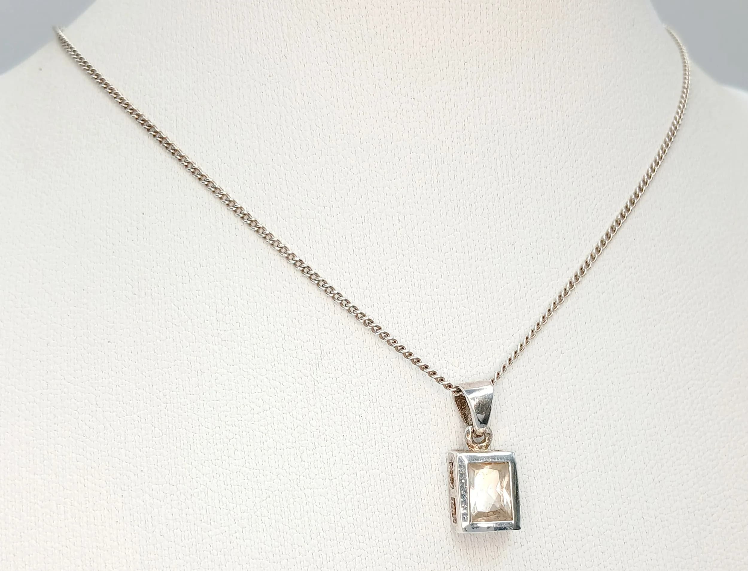 A Lovely 925 Silver CZ Stone Set Pendant Necklace-48cm Length Chain. The Pendant has a Square CZ Stone Set Drop measuring 0.8cm x 0.5cm. The Necklace has a gross weight of 3.18 grams.