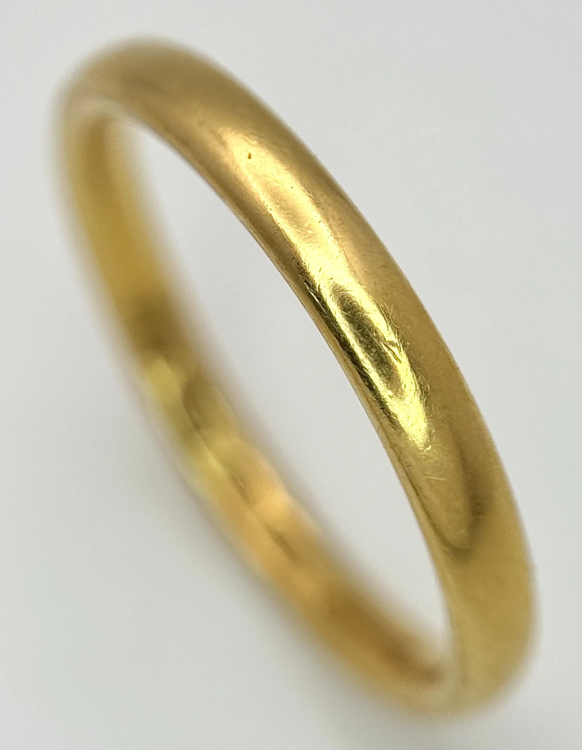 A 22K Yellow Gold Wedding Band. 2.4mm Band Width, Size O. Total Weight 3.55 Grams.