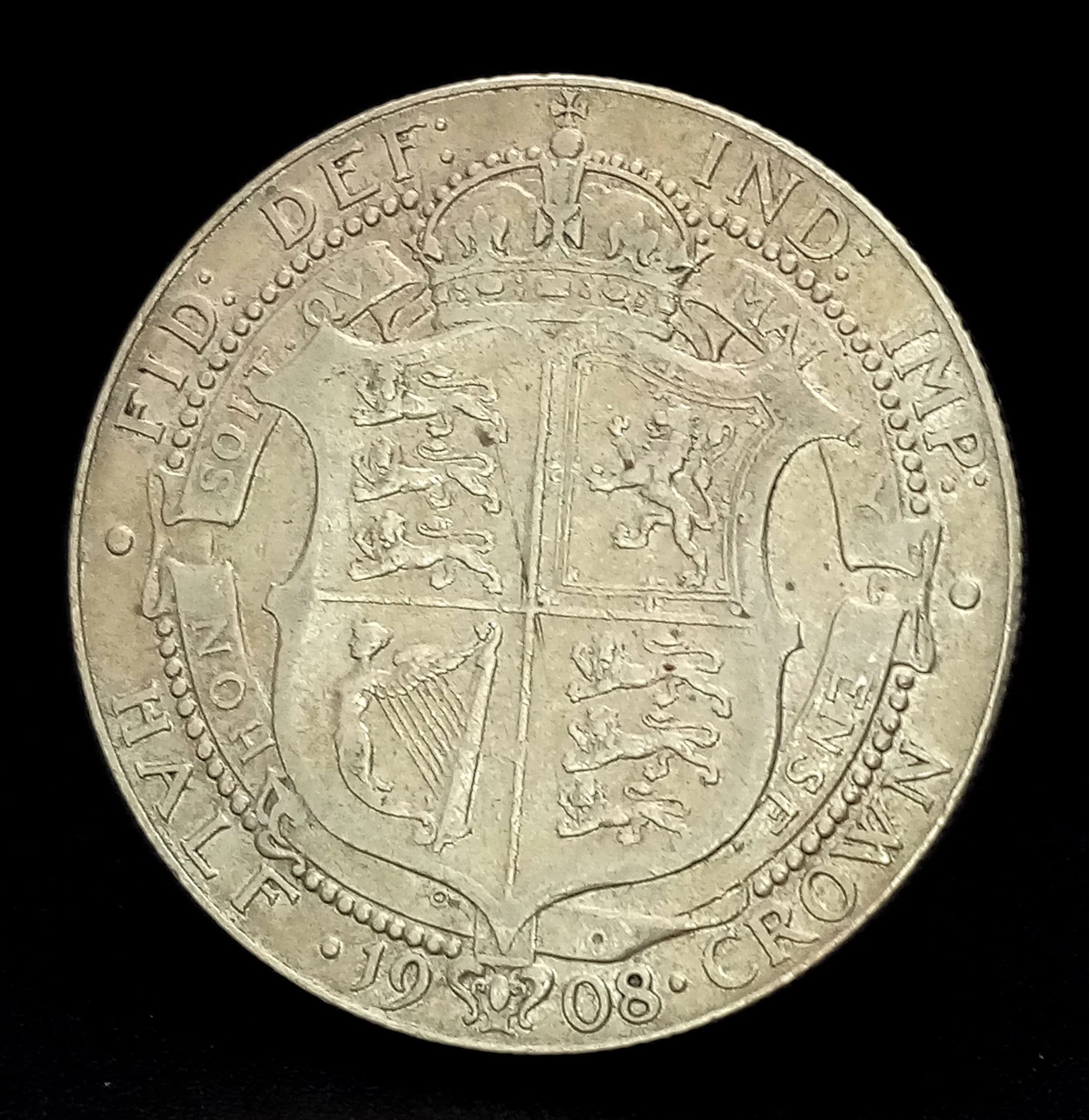 An Edward VII 1908 Silver Half Crown Coin. Obverse with bare head portrait of King Edward VII, reverse with crowned shield design. Dated 1908.