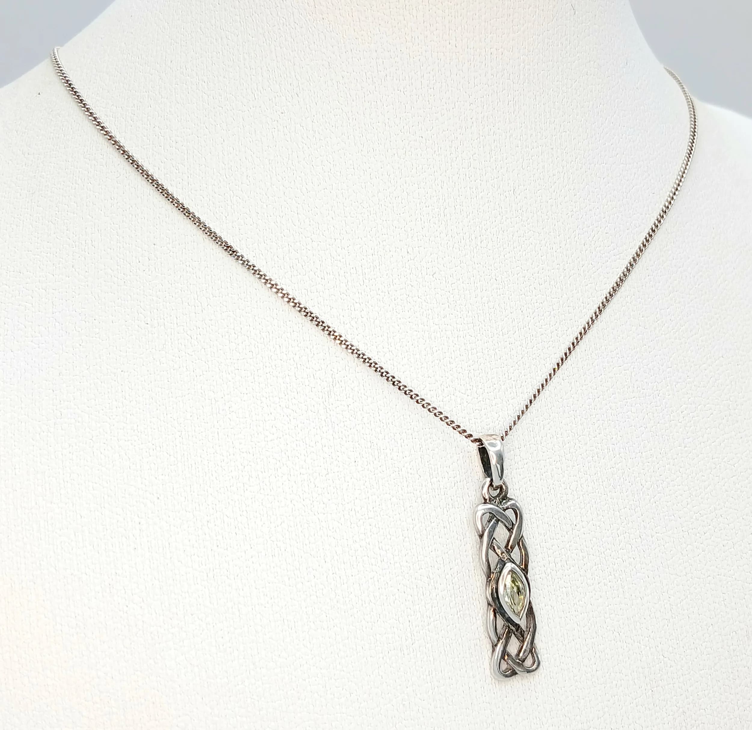 A Pretty 925 Sterling Silver Citrine Set Celtic knot Drop Pendant Necklace-44cm Length Chain. The Pendant features a Chain Link Drop Detail set with a Citrine Stone measuring 2mm x 7mm. The Pendant measures 2.5cm Drop. The Necklace has a gross weight of 2.75 grams.