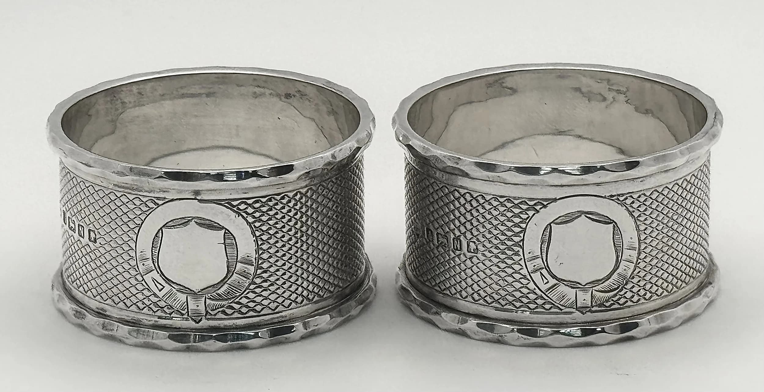 A Pair of Victorian Silver Napkin Rings. Hallmarks for Sheffield, 1880. Makers mark for Remi Martin & Edward Hall. 68.91g total weight. Ref: NLG 7/74006