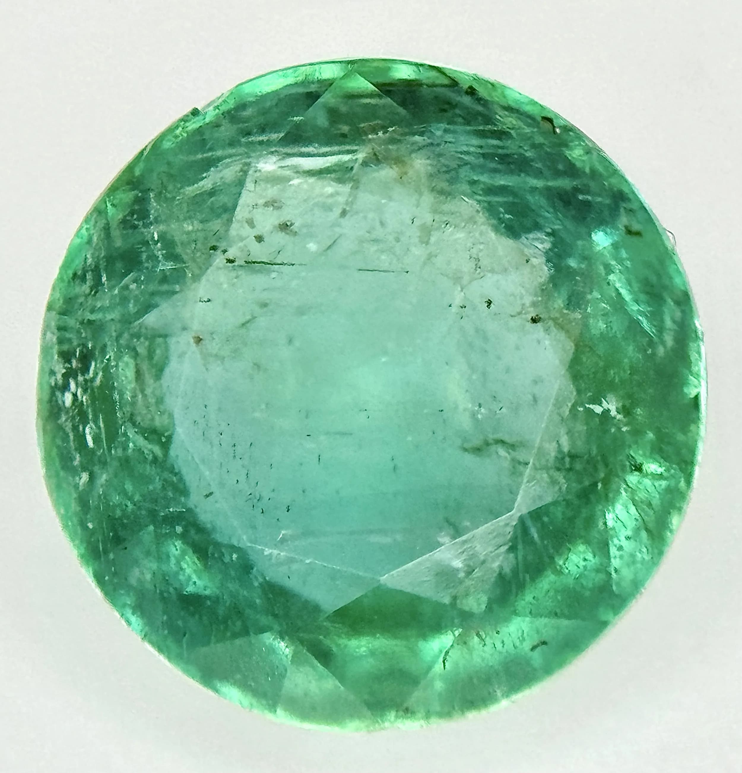 A 4.16ct Round Brilliant Cut Zambian Natural Emerald Gemstone. GFCO Switzerland certified. A rare investment-grade gemstone.This emerald has striking brilliance and a captivating play of light, uncommon amongst emeralds of this size. Originating from Zambia, one of the most respected and consistent sources of fine emeralds, this gemstone displays a lush, vibrant green hue with impressive clarity and depth of colour. It has been graded as having 'Insignificant Oil', the best possible clarity enhancement rating for emeralds. This minimal treatment preserves the stone's natural beauty whilst making it suitable for the most demanding collectors and connoisseurs. Ref: BVC 03