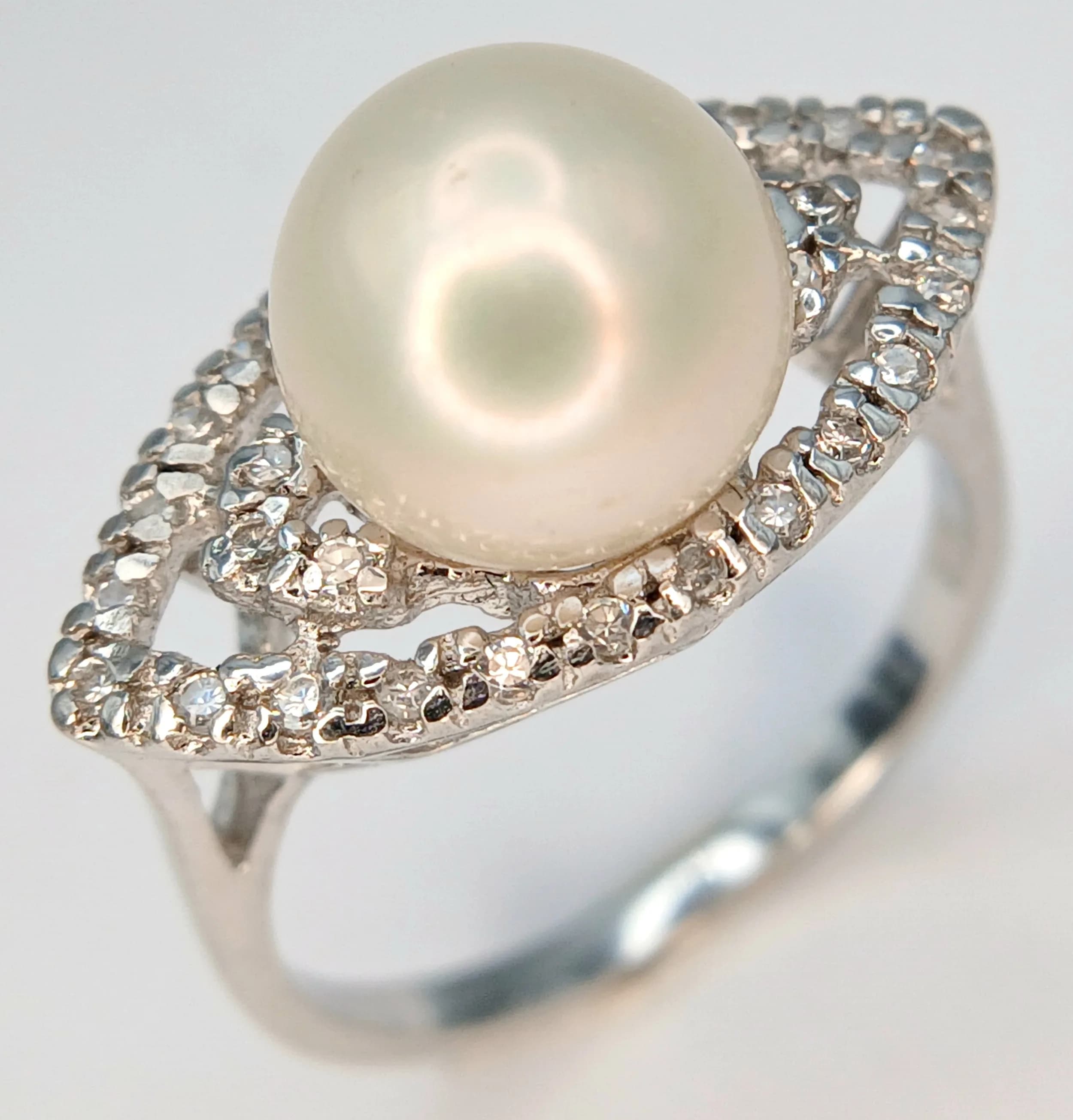 A 925 Silver Pearl and CZ Stone Set Ring. Size N 1/2. Total weight: 3.65g.