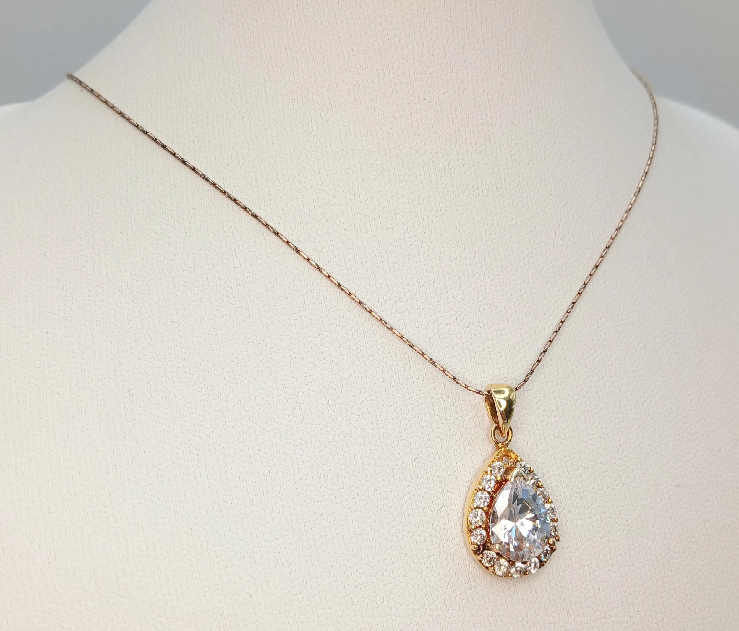 A 925 Italy Silver pear shaped CZ Stone Set Pendant Necklace. Total weight 4.55g. Approx 44cm chain length with a 2cm pendant drop.