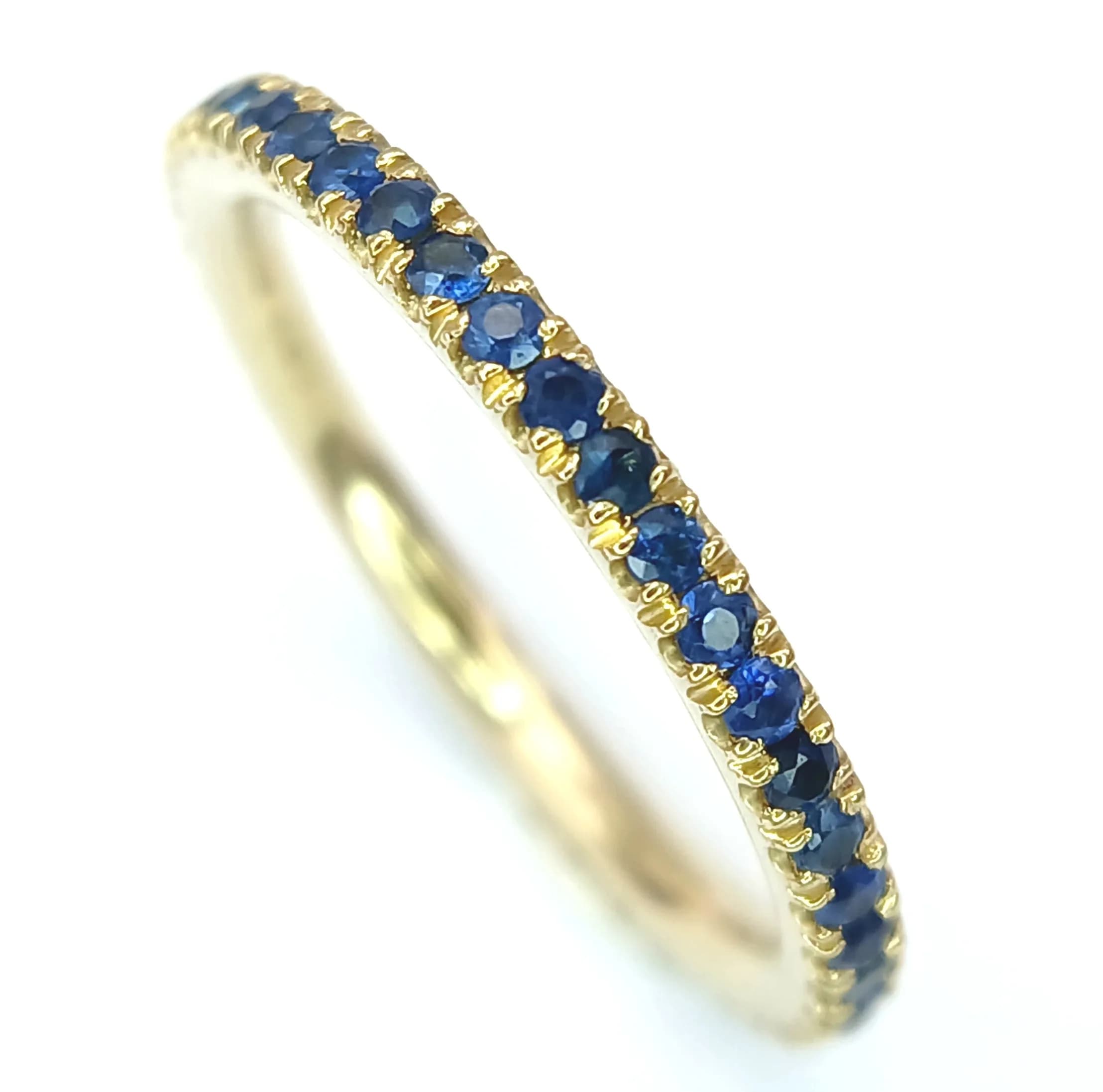 A 9K Yellow Gold Sapphire Eternity Ring. Size K. 1.6g. Ref: 4.2.