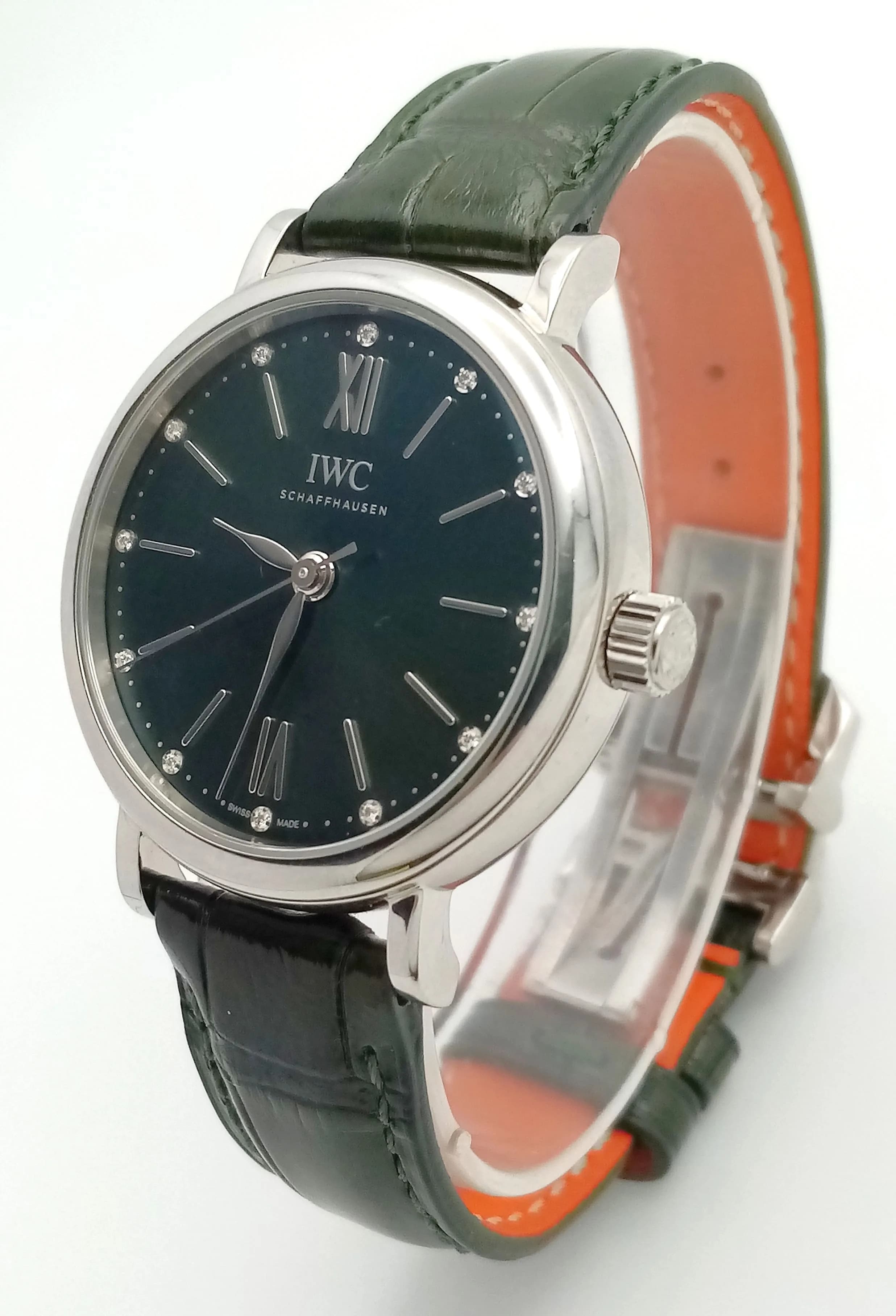 An IWC Diamond Schaffhausen Portofino Automatic Ladies Watch. Green leather strap with fold-over clasp. Stainless steel case - 34mm. Green dial with baton diamond tipped markers. In working order. Ref: 020434.