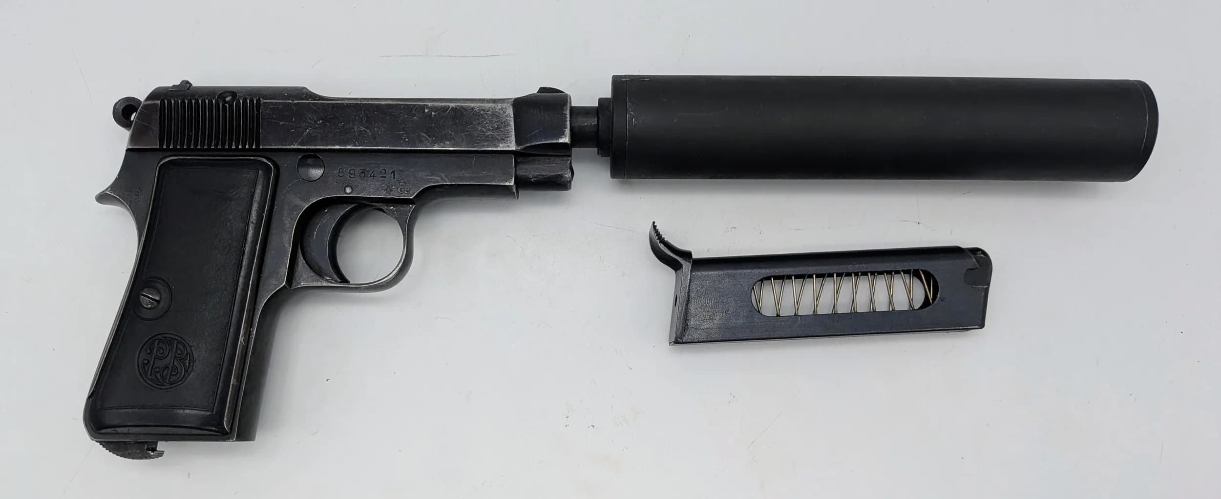 A Deactivated Italian Beretta Pistol with Detachable Silencer. 7.65mm calibre. 4 inch barrel length. 6 inch silencer. Retractable magazine. Comes with an EU deactivation certificate. UK/EU sales only, Not Holland. UK Mainland shipping only or arrange a courier.