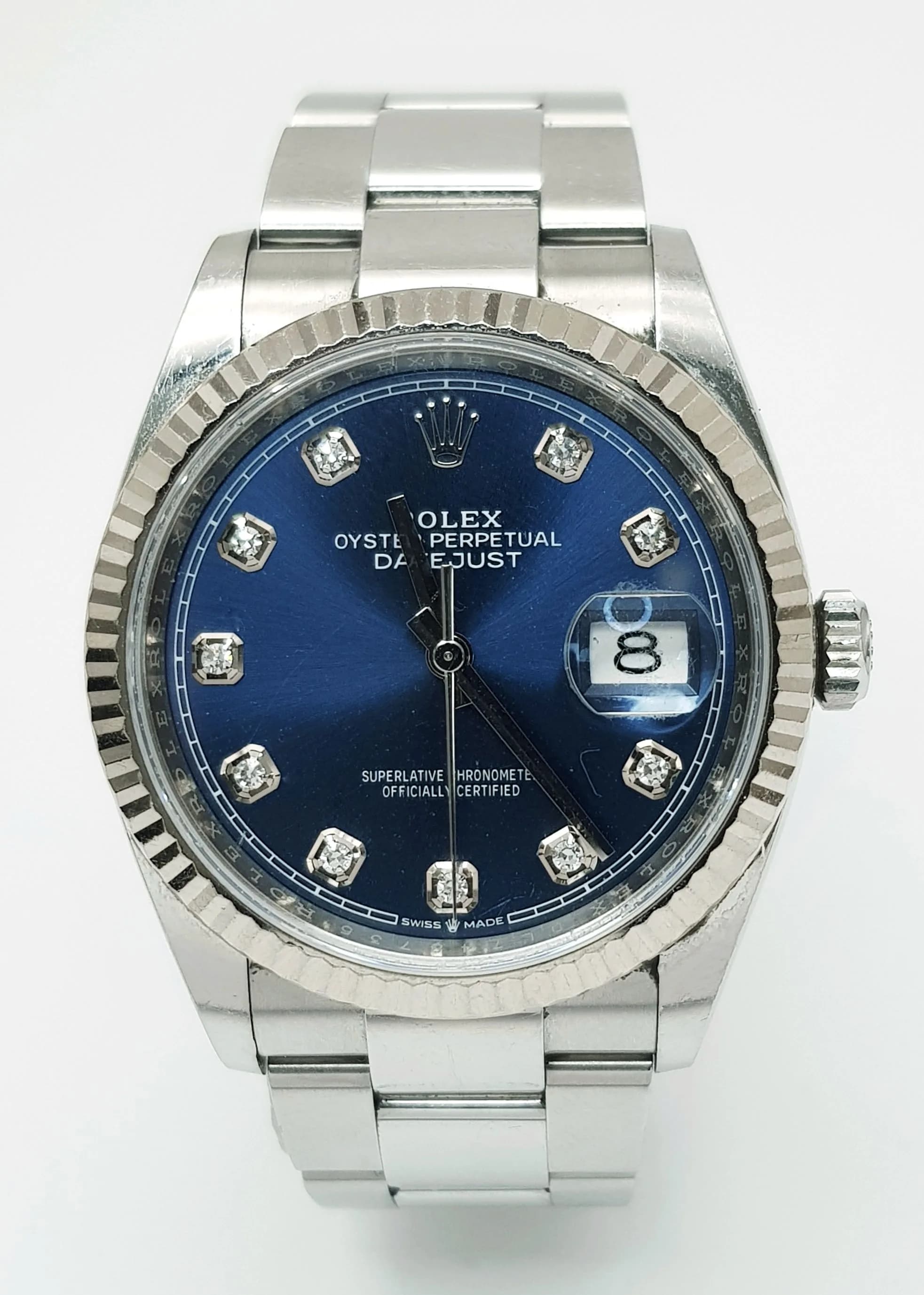 An Ice Blue and Diamond Dial Rolex Datejust Automatic Watch. Model 126234. Stainless steel bracelet and case - 36mm. Fluted bezel. Blue dial with diamond makers. Comes with box, spare links and papers. In good condition and working order. Ref: 028433.