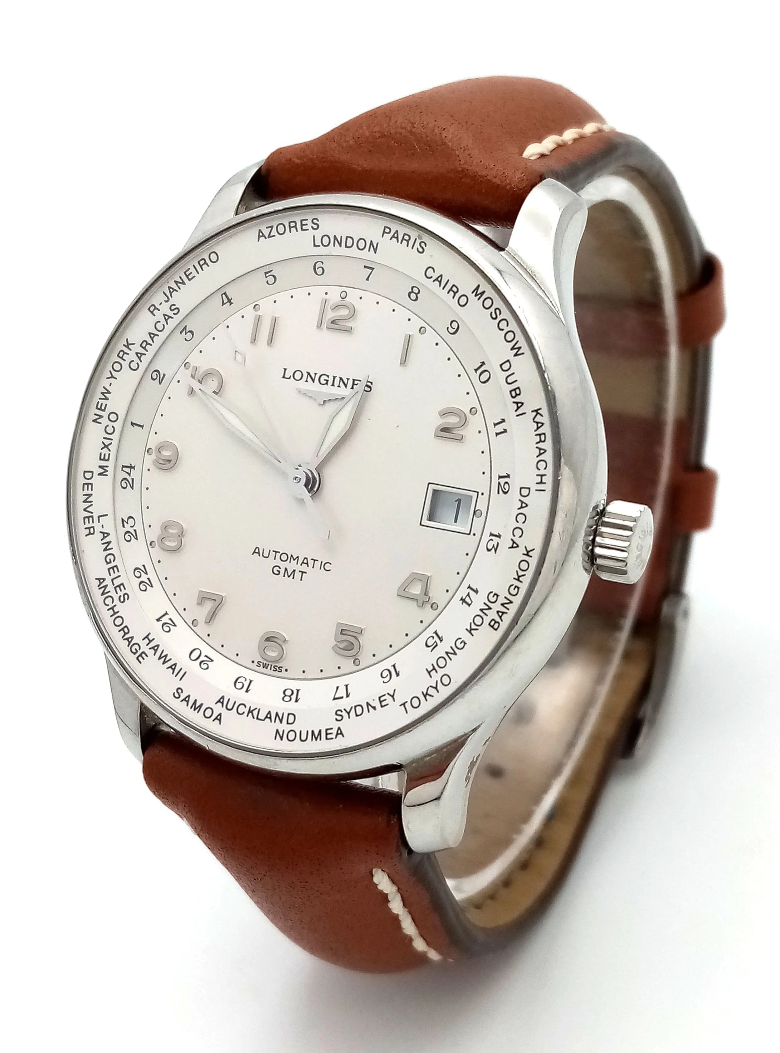 A Longines Automatic GMT Gents Watch. Model 12.631.4. Brown leather strap. Stainless steel case - 38mm. White dial with date window. Skeleton back. In working order. Comes with a WCSA report. Ref: 029298.