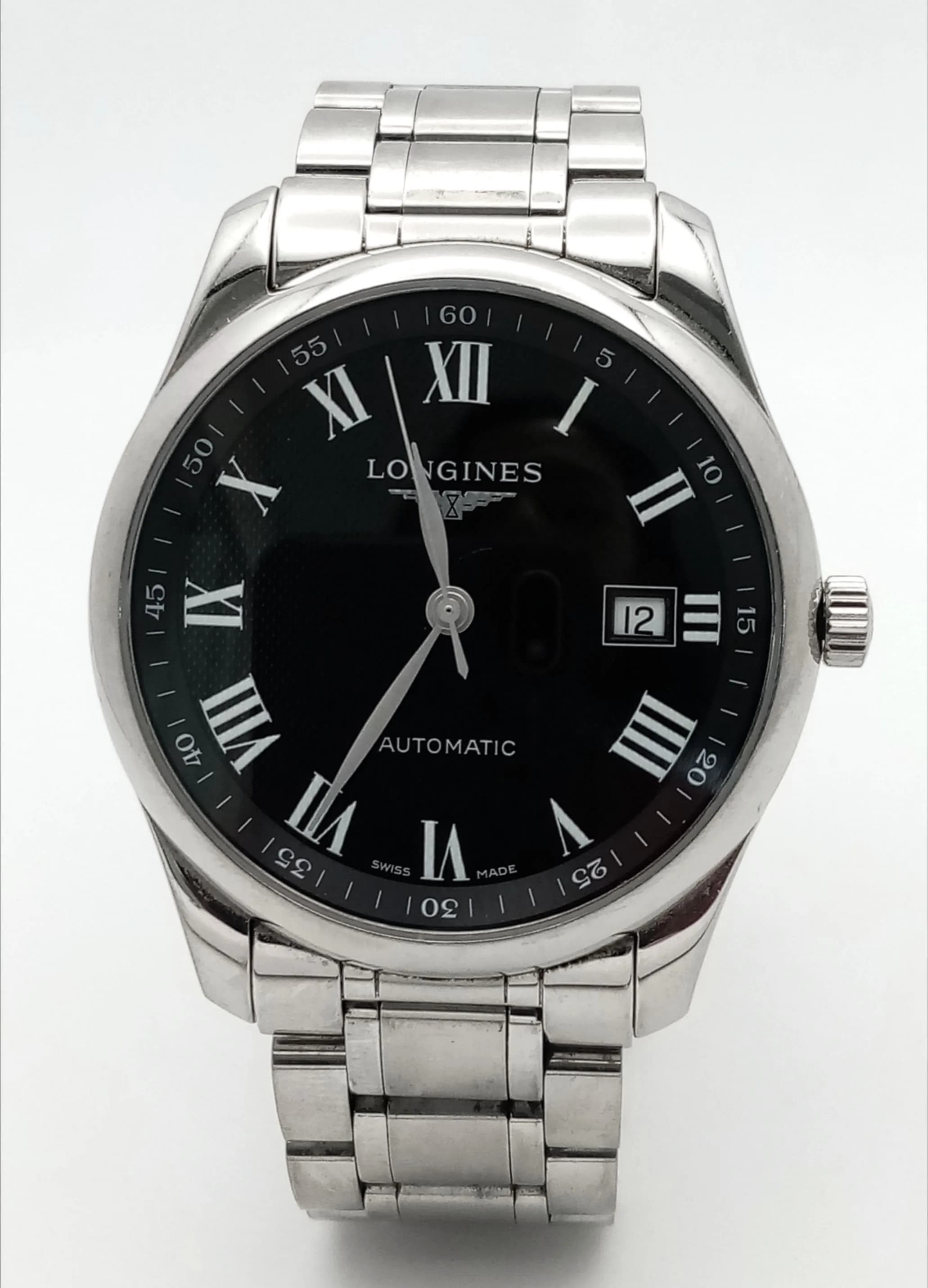A Longines Automatic Gents Watch - The Master Collection. Model l2.793.4. Stainless steel bracelet and case - 40mm. Black dial with Roman numerals and date window. Skeleton back. In good condition and working order. Comes with a WCSA report. Ref: 029297