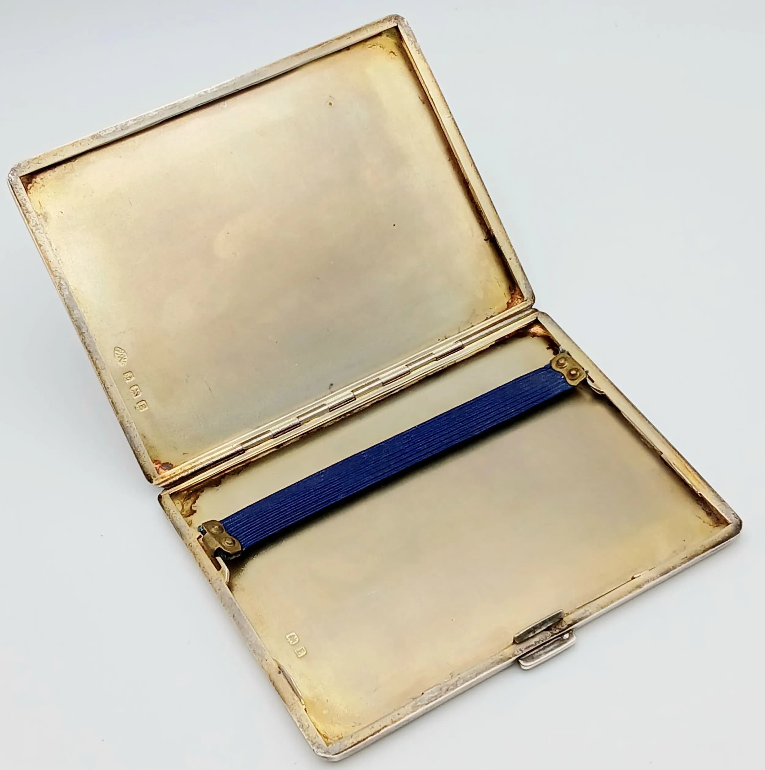 A Vintage Art Deco Sterling Silver Cigarette Case. Gilded interior. Clasp works well. 10.5 x 8.5cm. Hallmarks for Birmingham 1929. Makers mark of Adie Brothers. 158g.