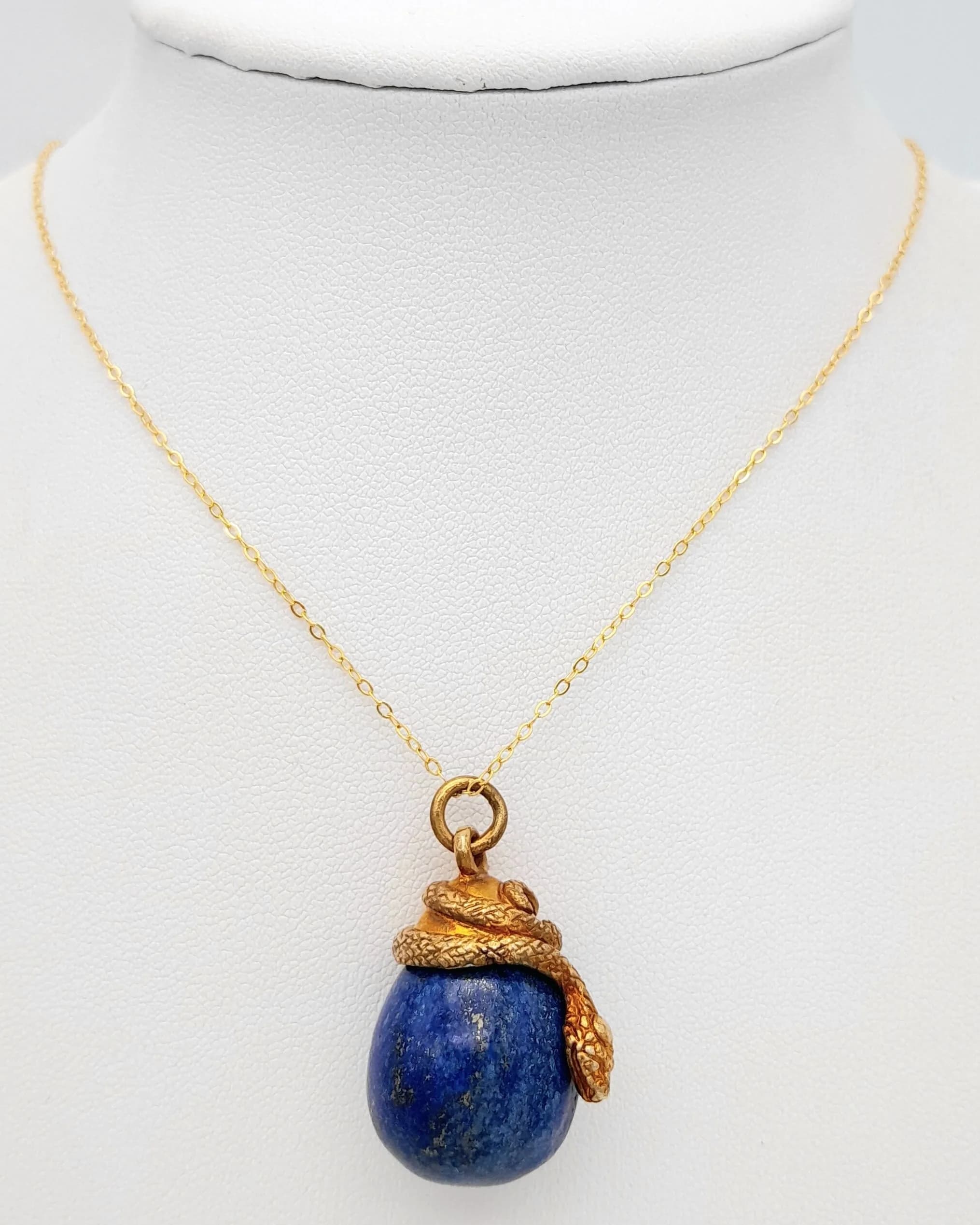 A Russian Imperial Design Gold Gilded and Sterling Silver Lapis Lazuli Snake and Egg Pendant Necklace-46cm Length chain. The Pendant measures a 3cm drop and is 2cm wide. Gross Weight 13.78 grams.