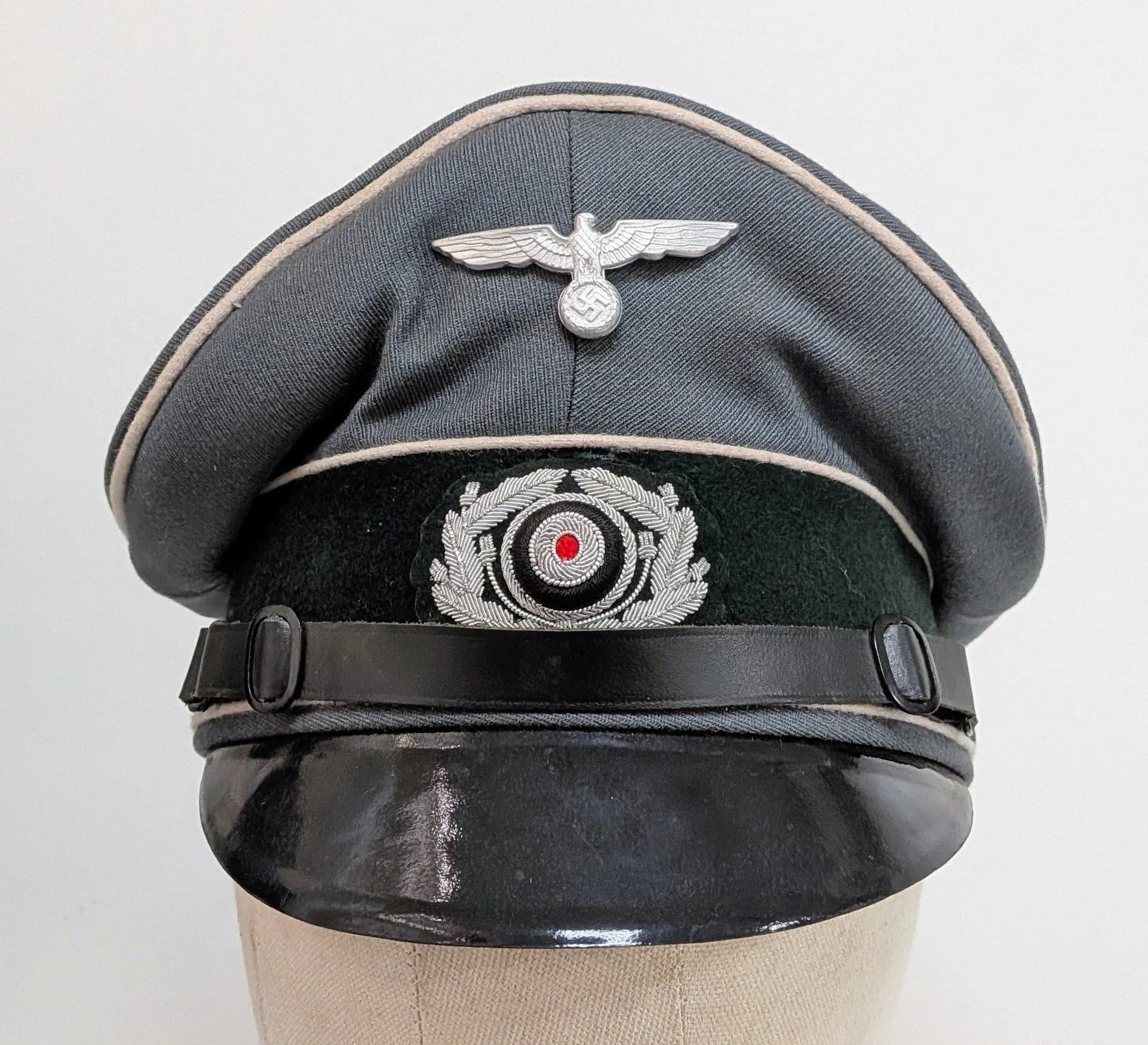 Amazing Quality Movie Prop WW2 German Officers Visor Cap. Perfect in every detail. Made by the German hat company “Cobra” who made them during the War and is now owned by Puma.