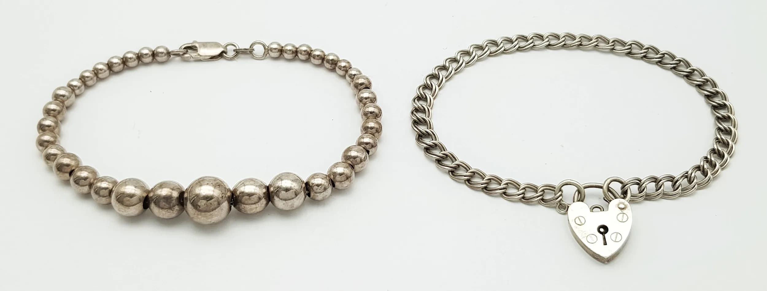 ITALIAN SILVER GRADUATED BRACELET together with a Fully Hallmarked DOUBLE LINK SILVER BRACELET with PADLOCK FASTENING. Both Bracelets approx 19 cm. Please see all pictures.
